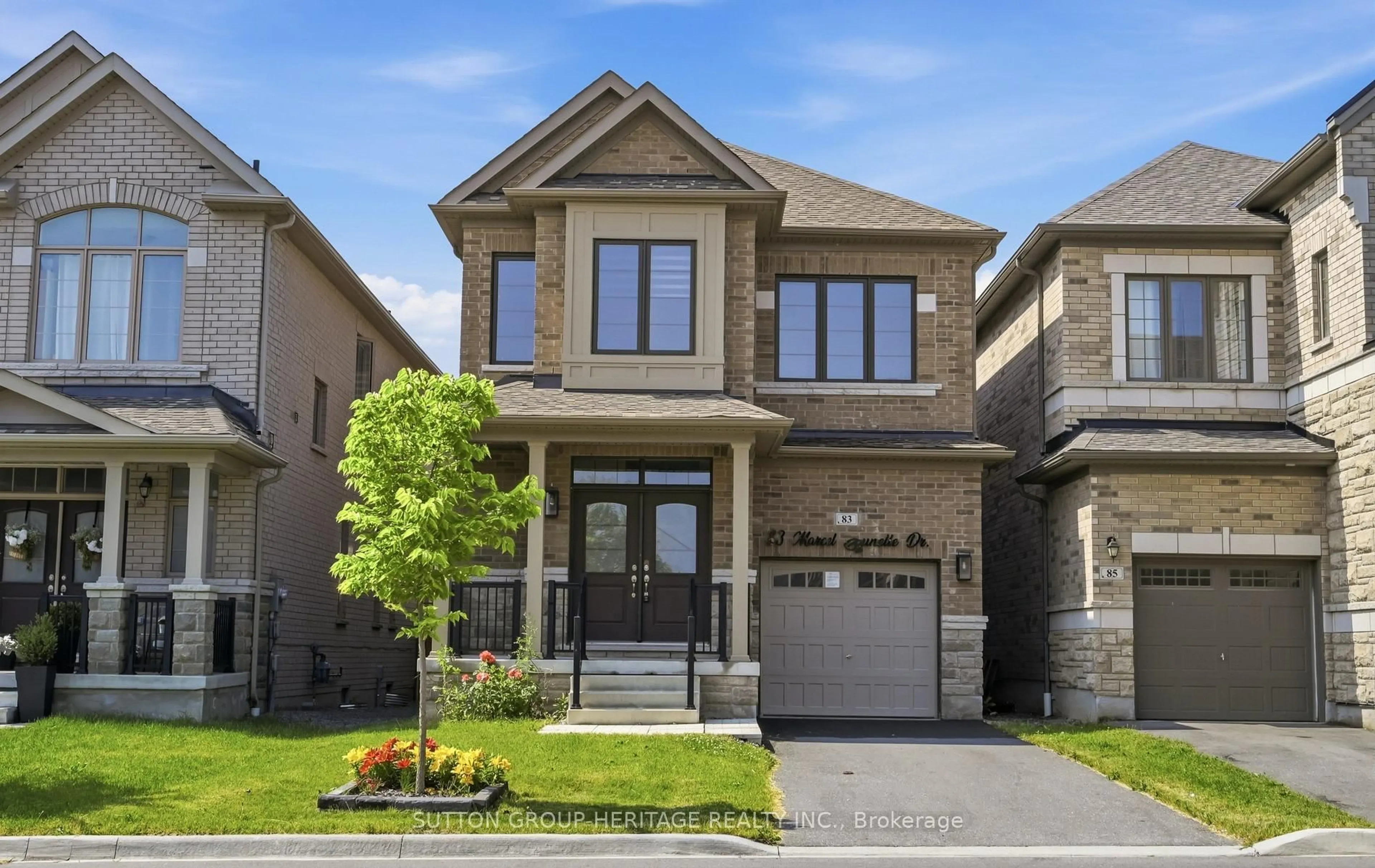 Home with brick exterior material, street for 83 Marcel Brunelle Dr, Whitby Ontario L1P 0G9