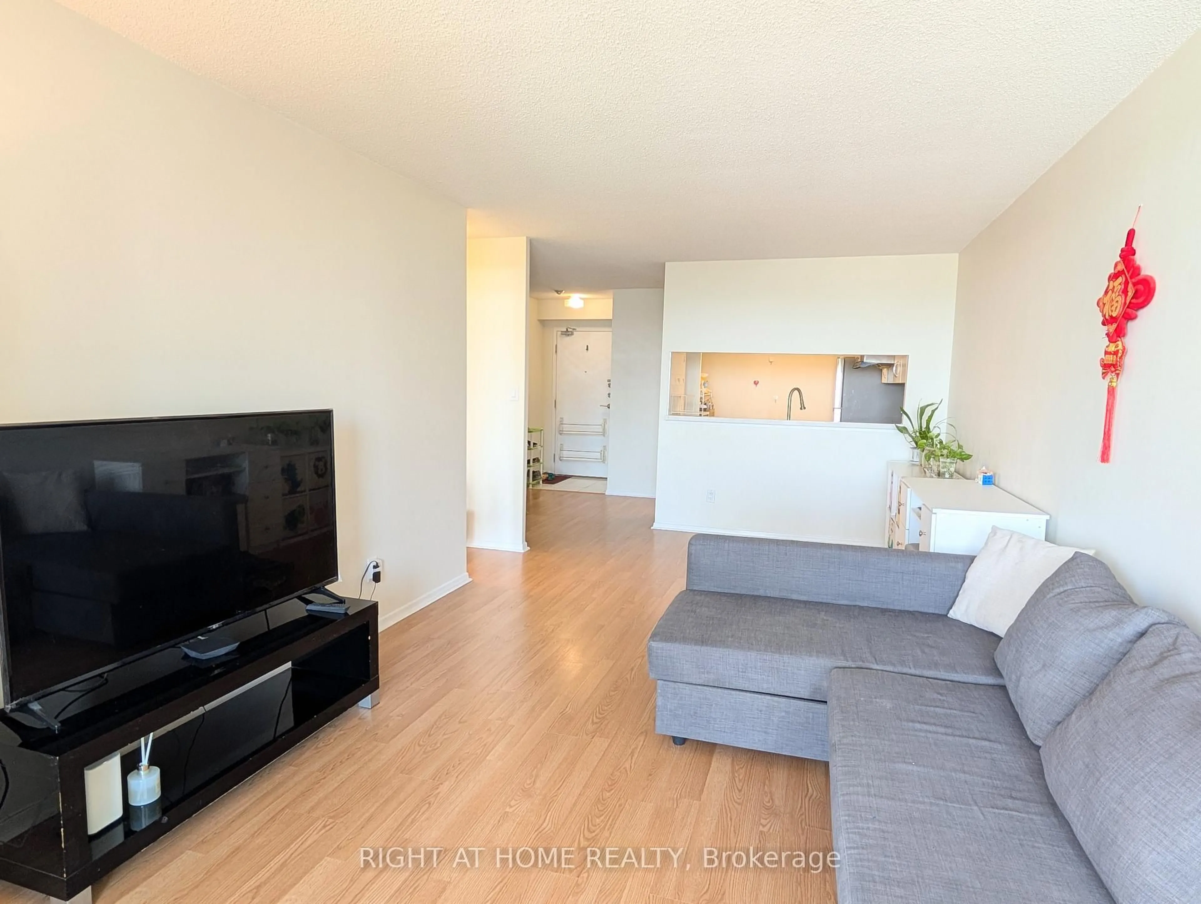 Living room with furniture, wood/laminate floor for 275 BAMBURGH Circ #1510, Toronto Ontario M1W 3X4