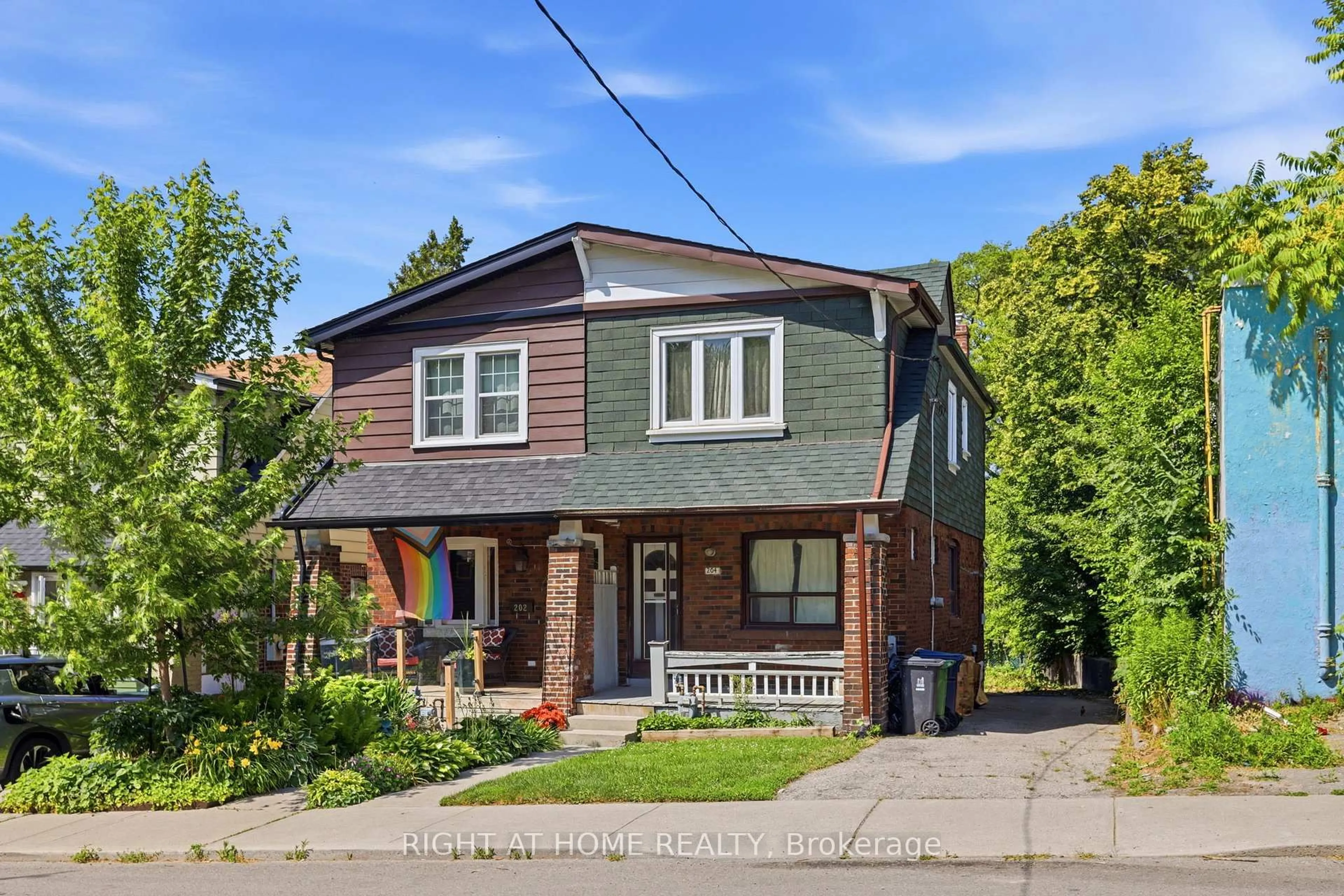 Home with brick exterior material, street for 204 Highfield Rd, Toronto Ontario M4L 2V3