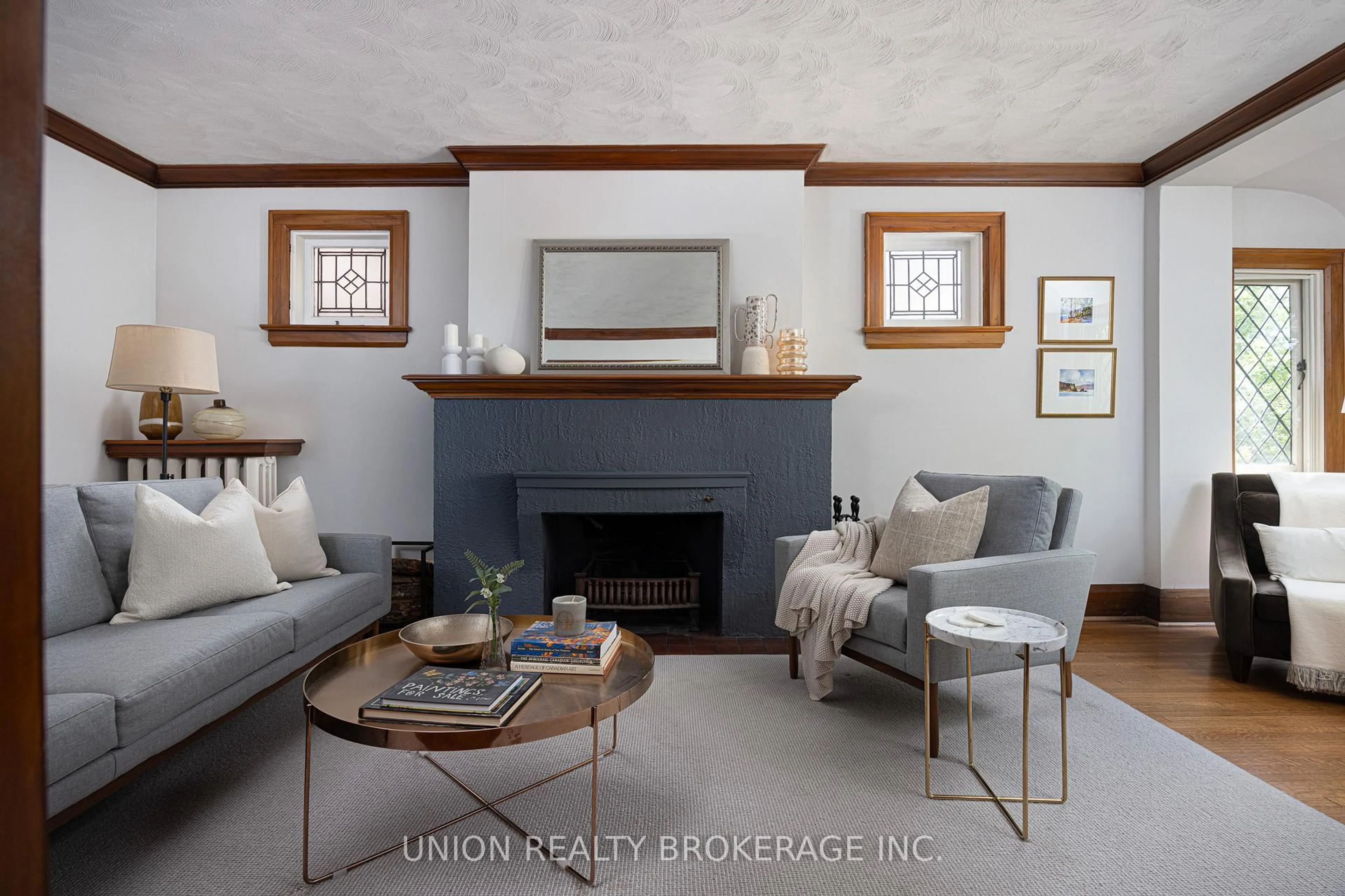 Living room with furniture, wood/laminate floor for 51 Pine Cres, Toronto Ontario M4E 1L3
