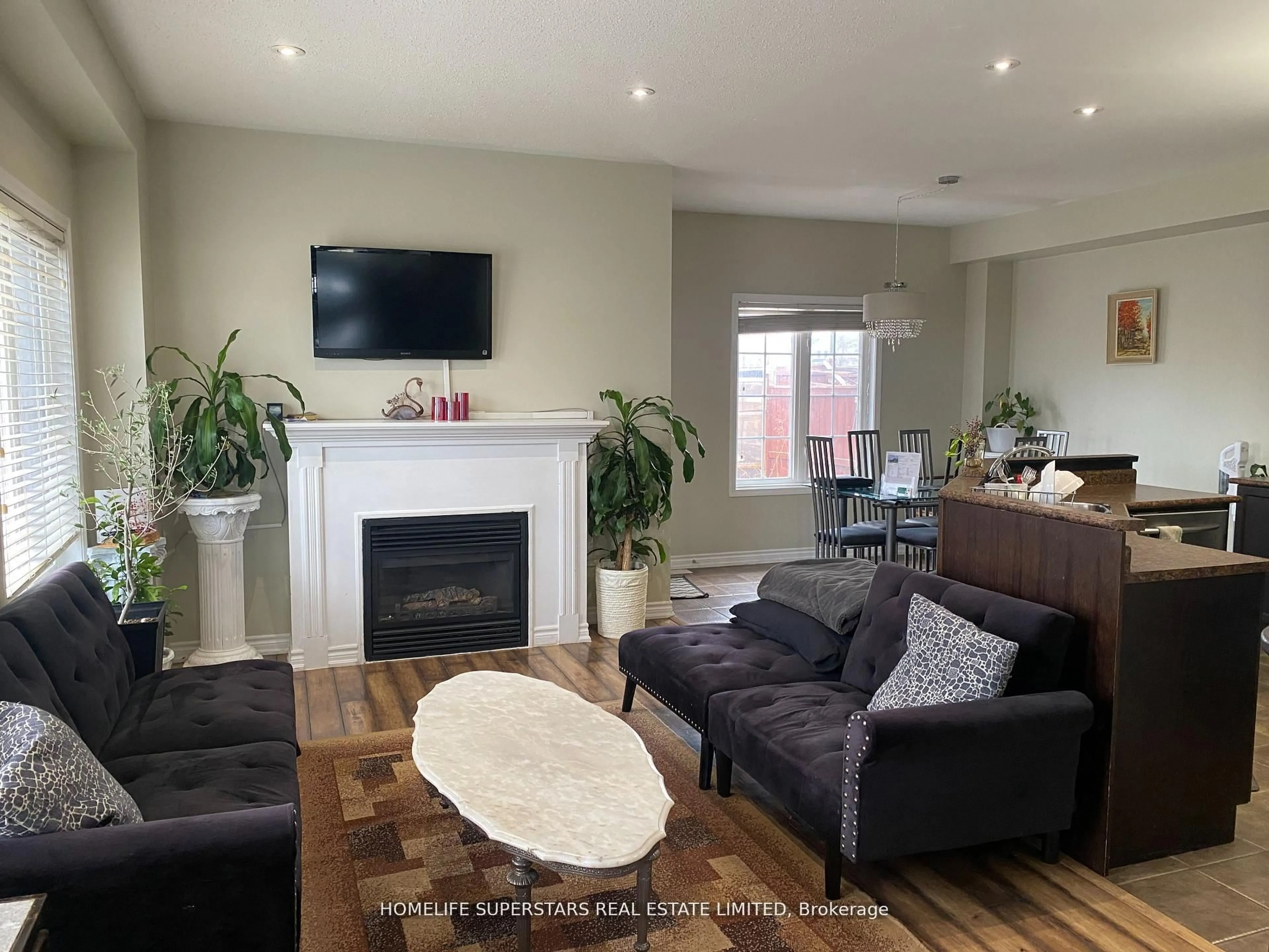 Living room with furniture, wood/laminate floor for 1316 Macinally Crt, Oshawa Ontario L1K 0B6