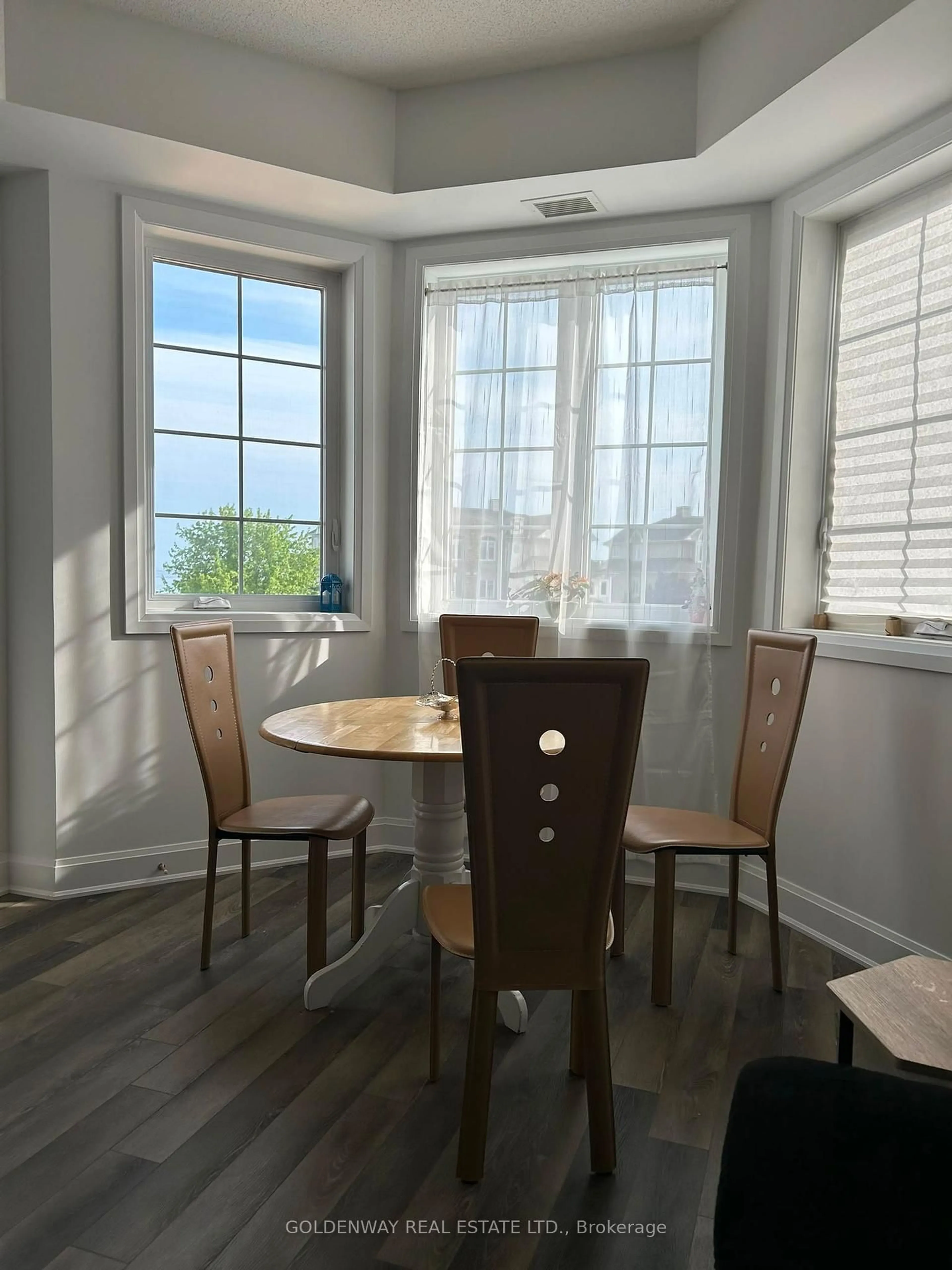 Dining room, wood/laminate floor for 50 Lakebreeze Dr #307, Clarington Ontario L1B 0V9