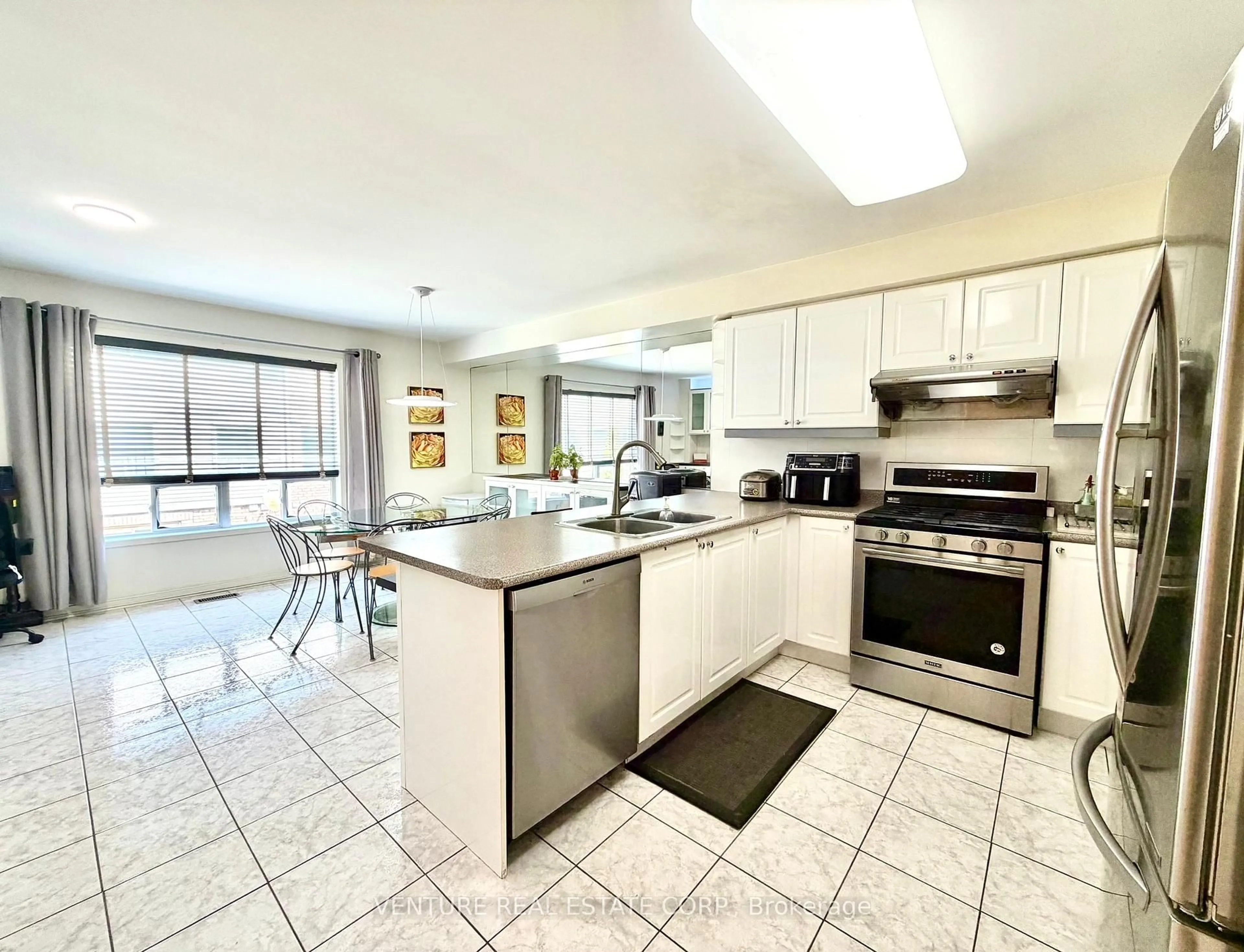 Open concept kitchen, ceramic/tile floor for 65 Mike Myers Dr, Toronto Ontario M1P 5G4
