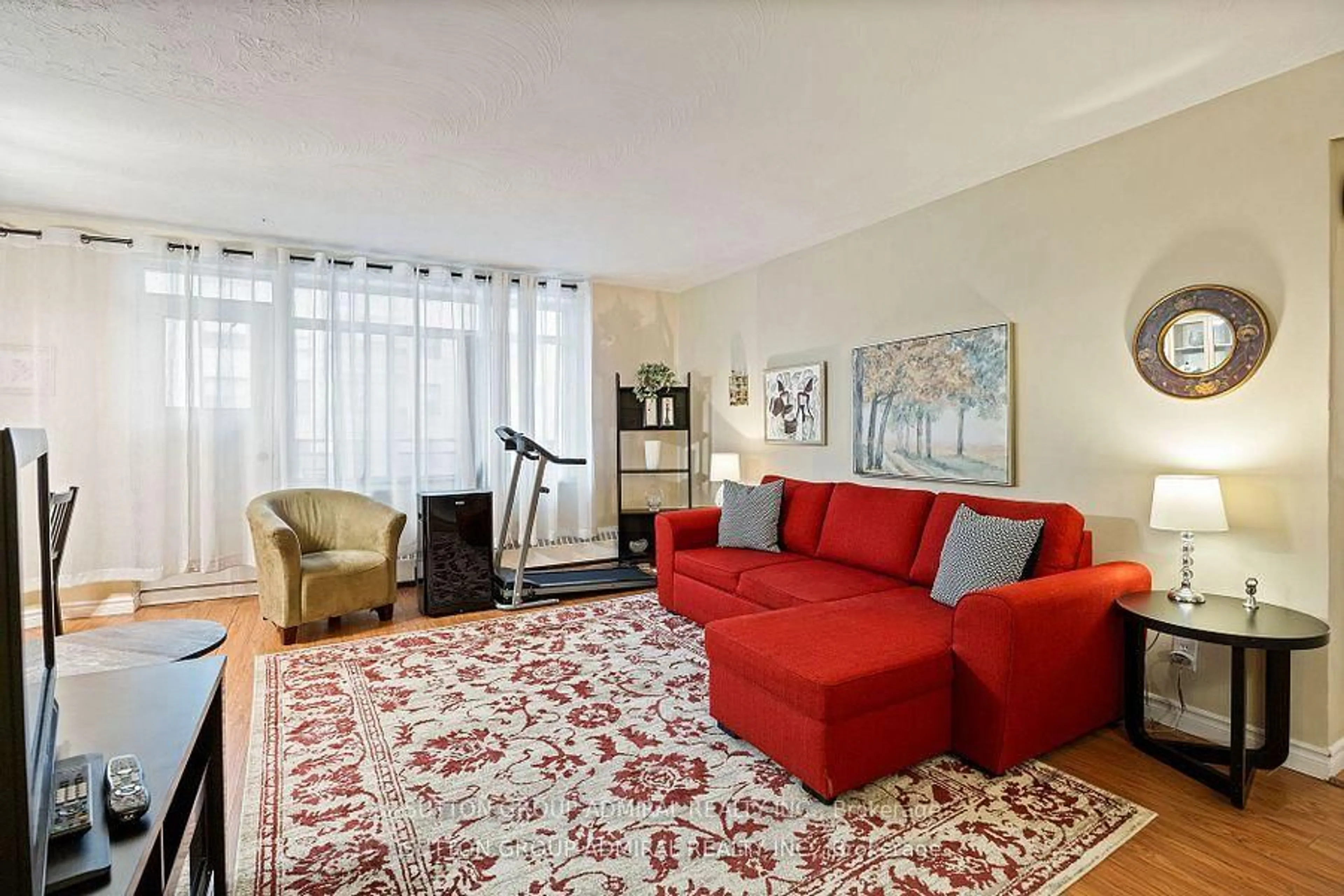 Living room with furniture, carpet floor for 825 Kennedy Rd #406, Toronto Ontario M1K 2E6