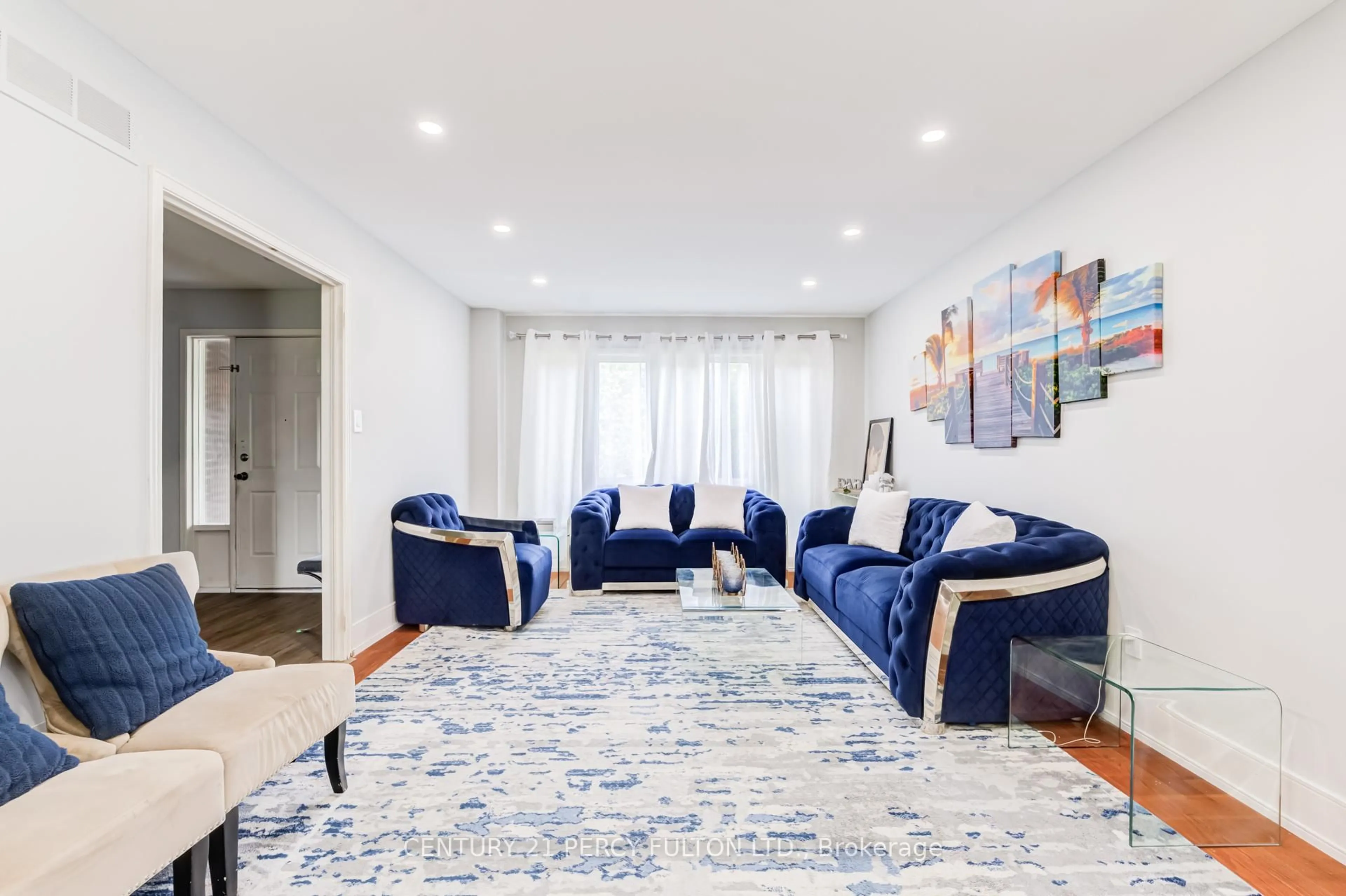 Living room with furniture, carpet floor for 79 Huntsmill Blvd, Toronto Ontario M1W 2Z8