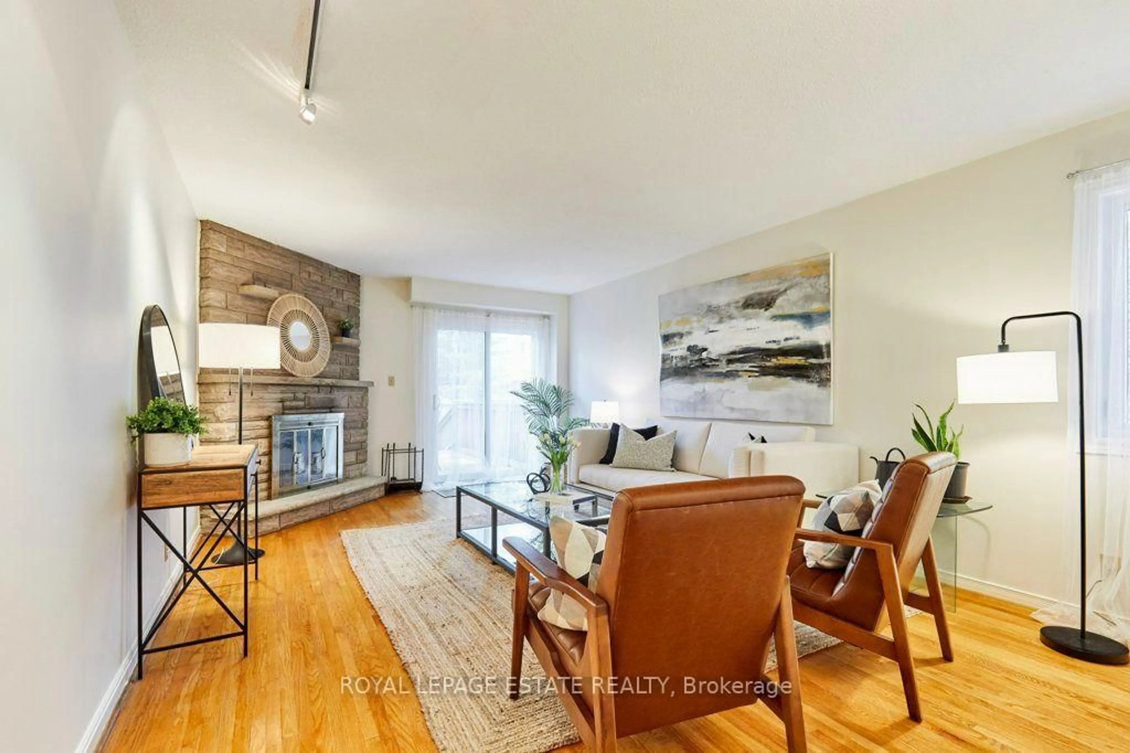 Living room with furniture, wood/laminate floor for 20 Pine Ave, Toronto Ontario M4E 1L8