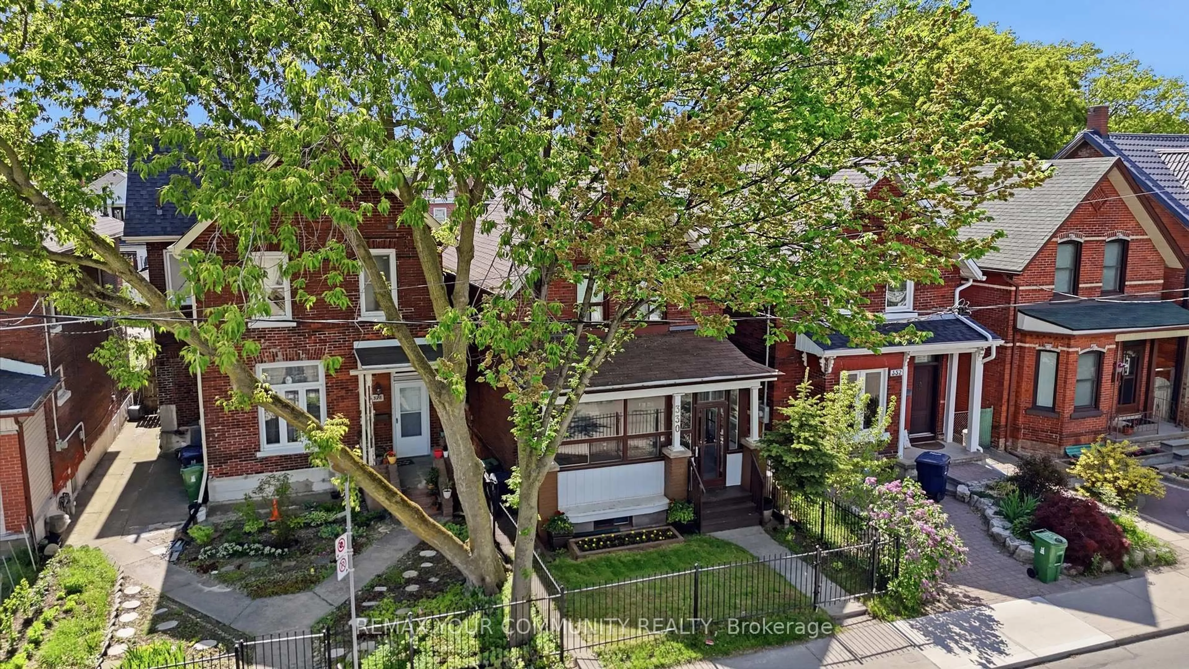 A pic from outside/outdoor area/front of a property/back of a property/a pic from drone, street for 330 Main St, Toronto Ontario M4C 4X7