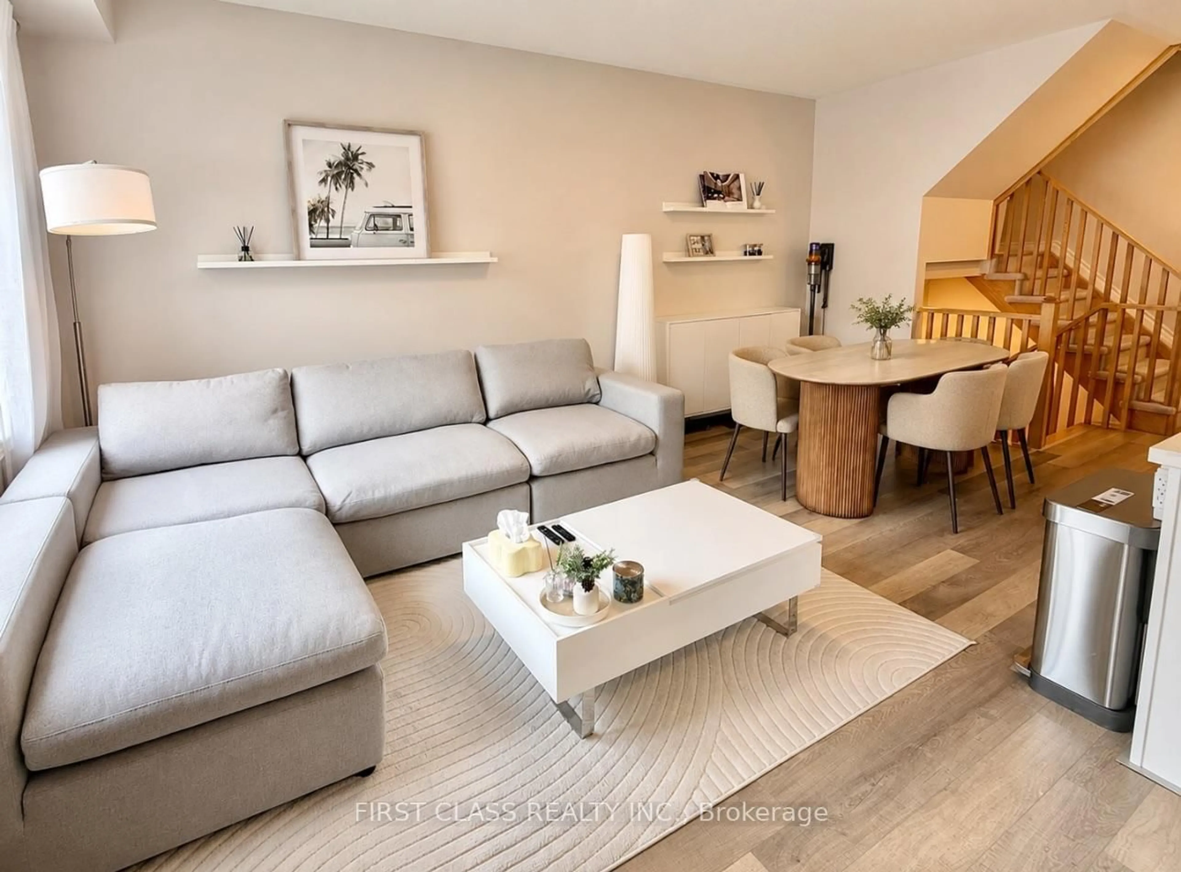 Living room with furniture, wood/laminate floor for 2468 Mayapple Cross, Pickering Ontario L1X 0E6