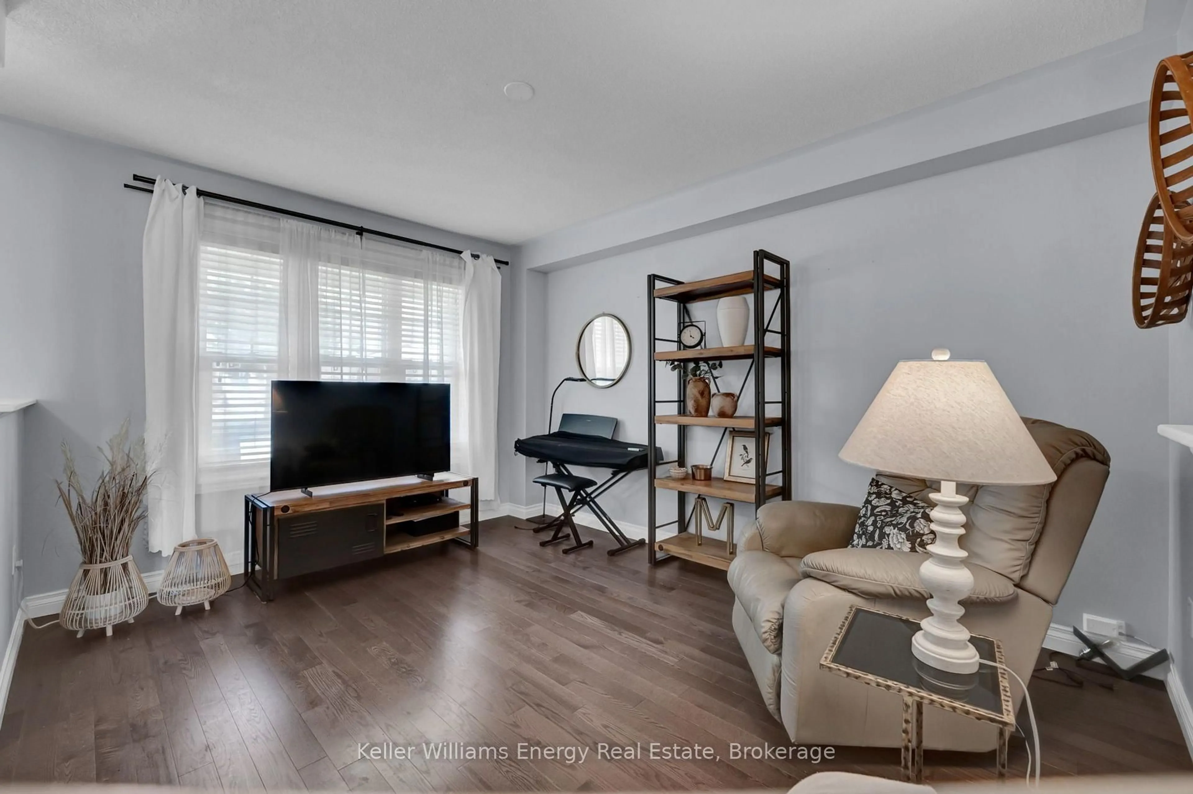 Living room with furniture, wood/laminate floor for 1502 Clearbrook Dr, Oshawa Ontario L1K 2S3