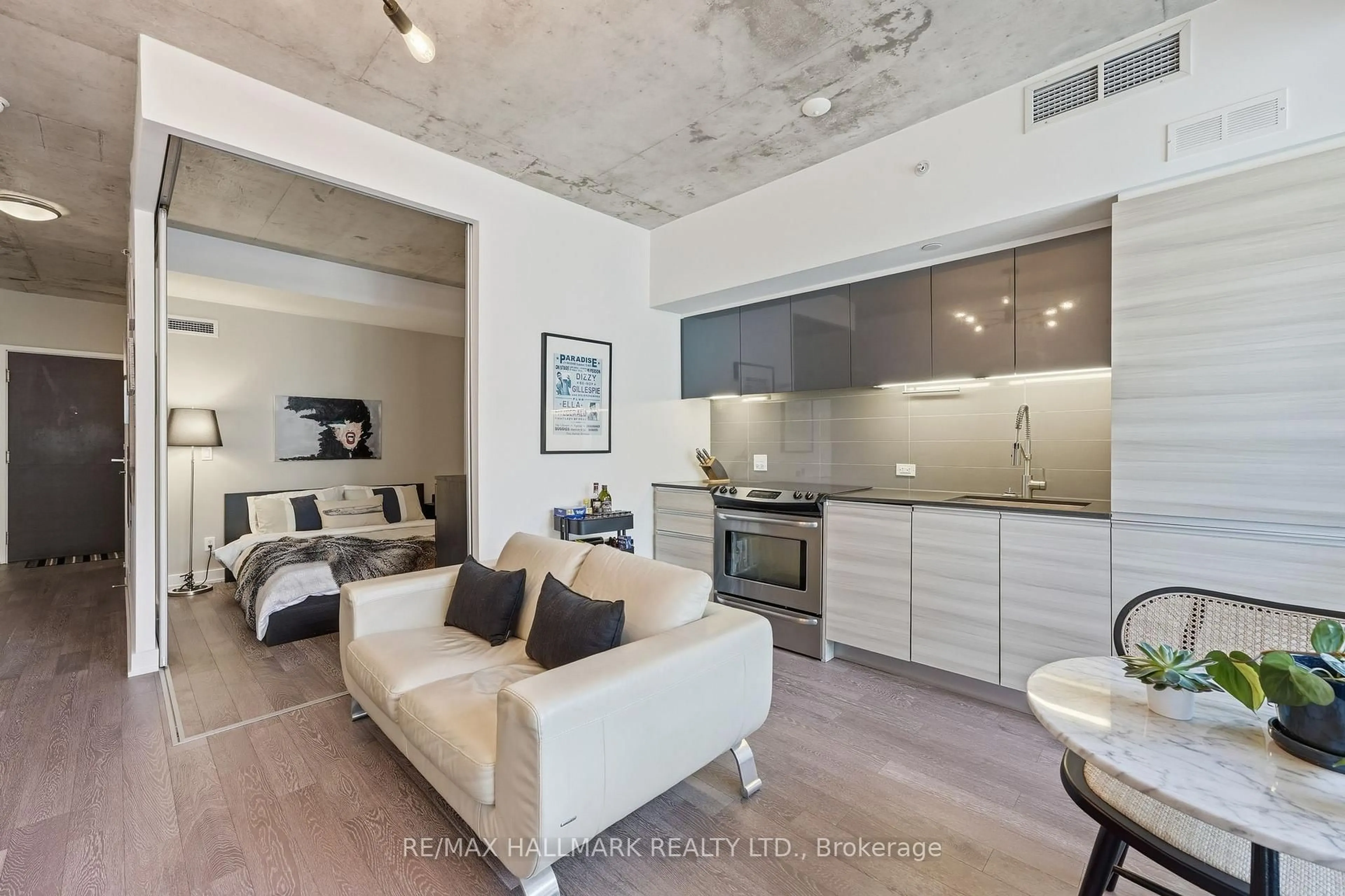 Open concept kitchen, cement floor for 1190 Dundas St #323, Toronto Ontario M4M 0C5