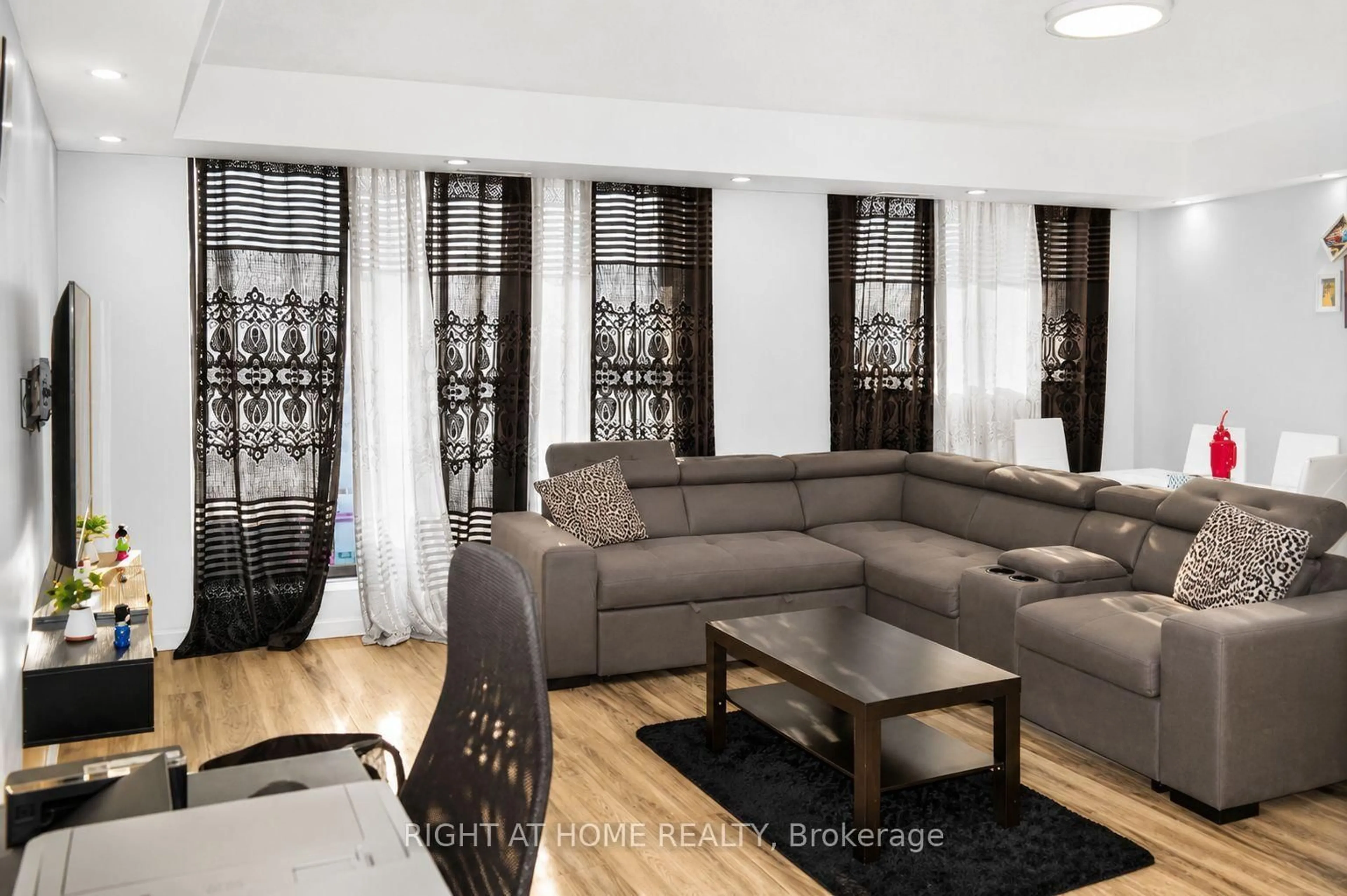 Living room with furniture, wood/laminate floor for 757 Victoria Park Ave #1501, Toronto Ontario M4C 5N8
