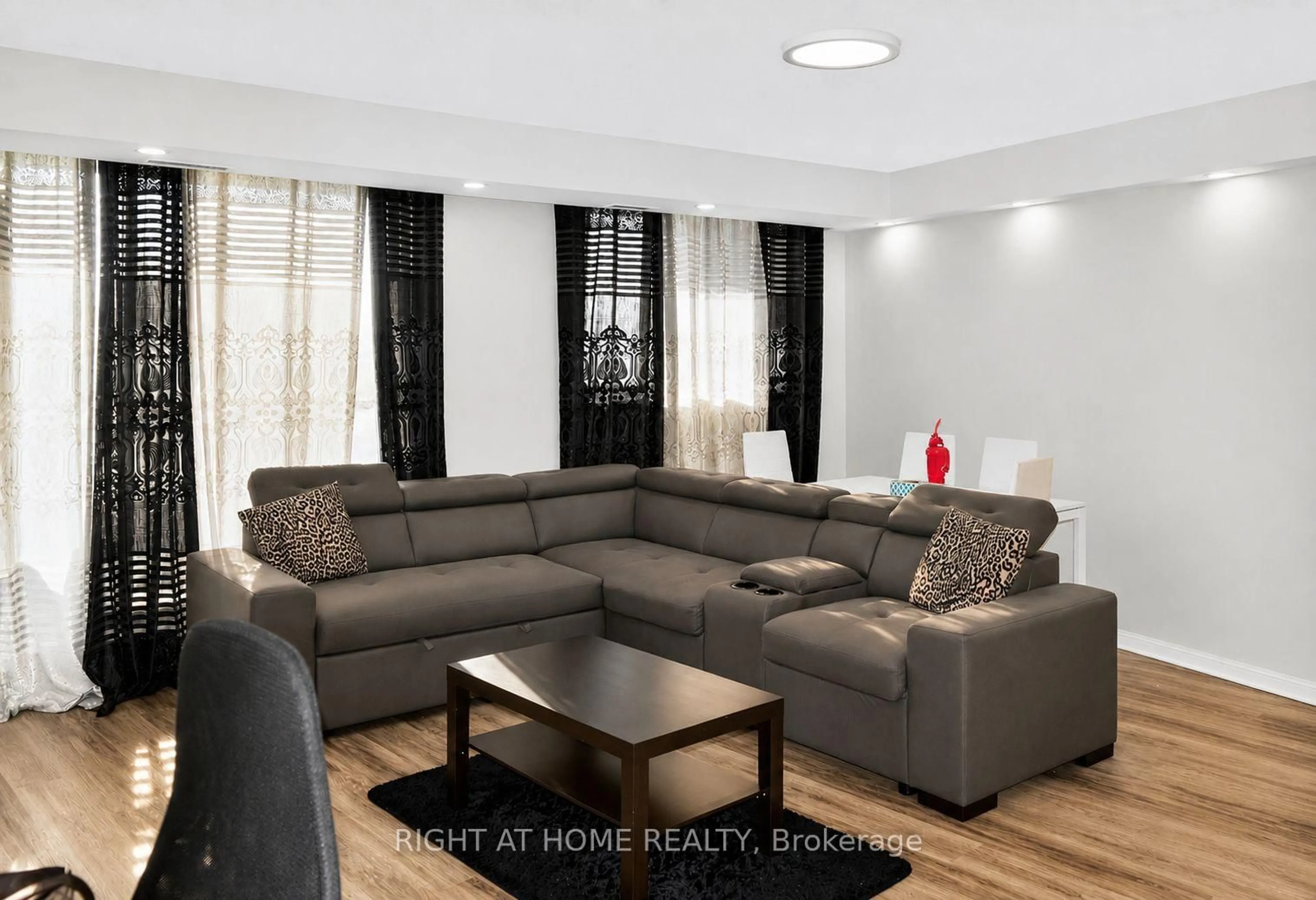 Living room with furniture, wood/laminate floor for 757 Victoria Park Ave #1501, Toronto Ontario M4C 5N8