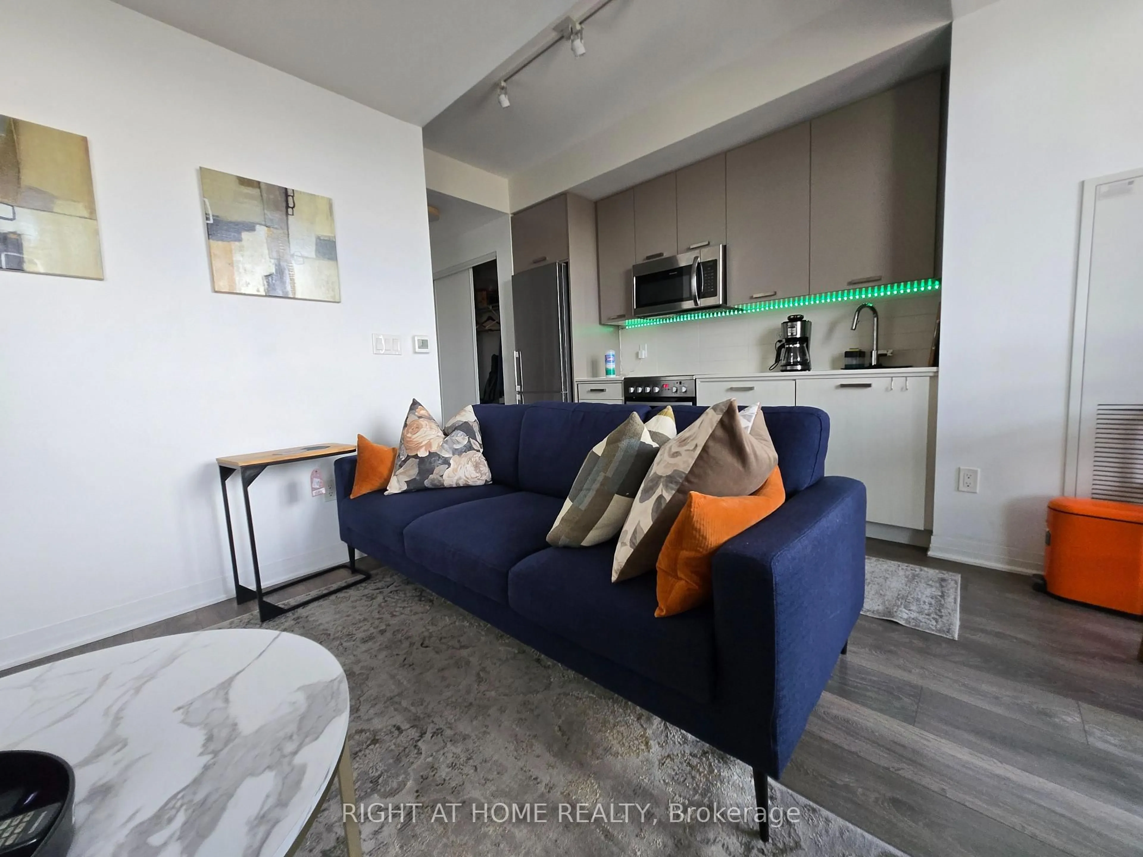Living room with furniture, unknown for 2301 Danforth Ave #715, Toronto Ontario M4C 0A7