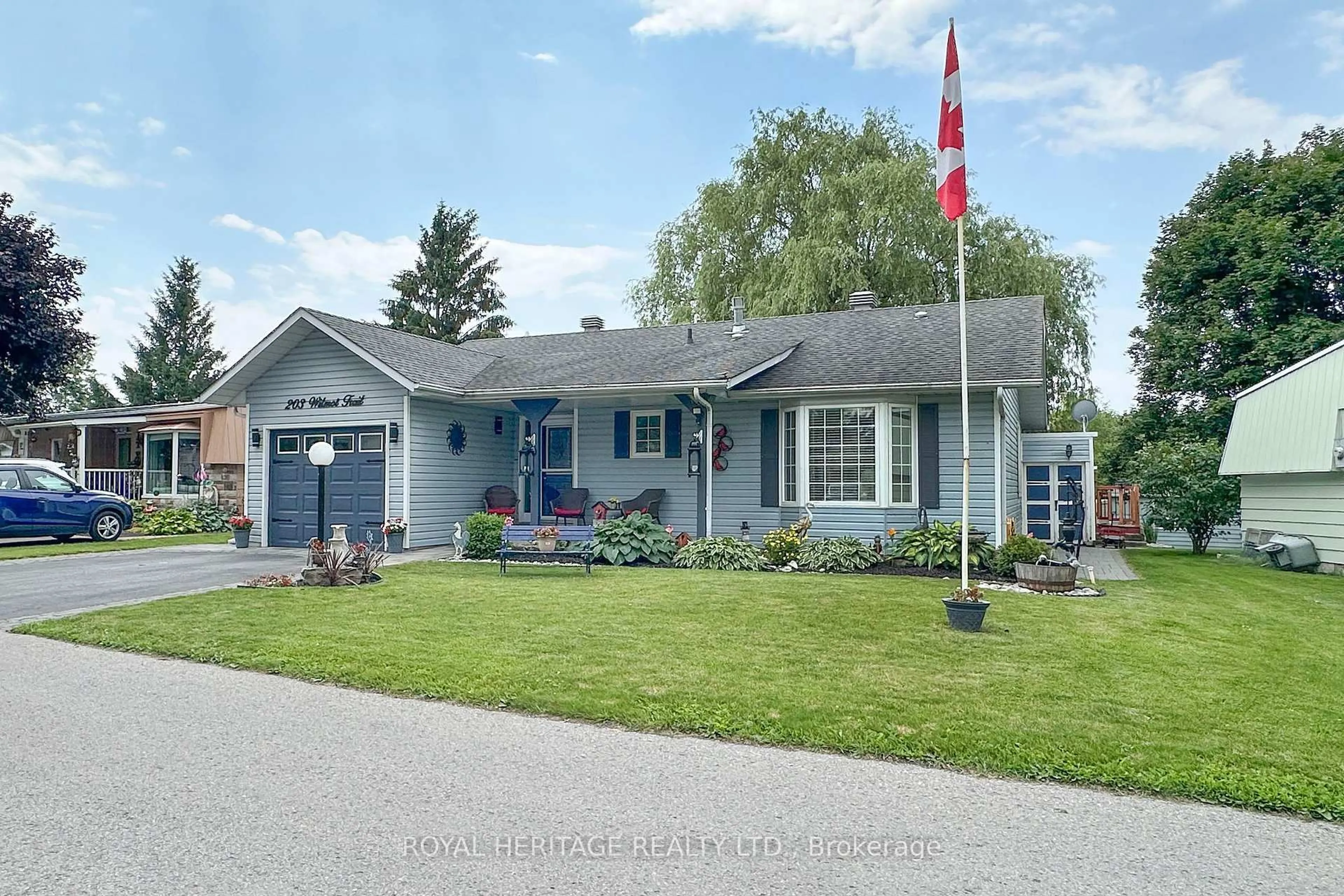 Home with vinyl exterior material, street for 203 Wilmot Tr, Clarington Ontario L1B 1A9