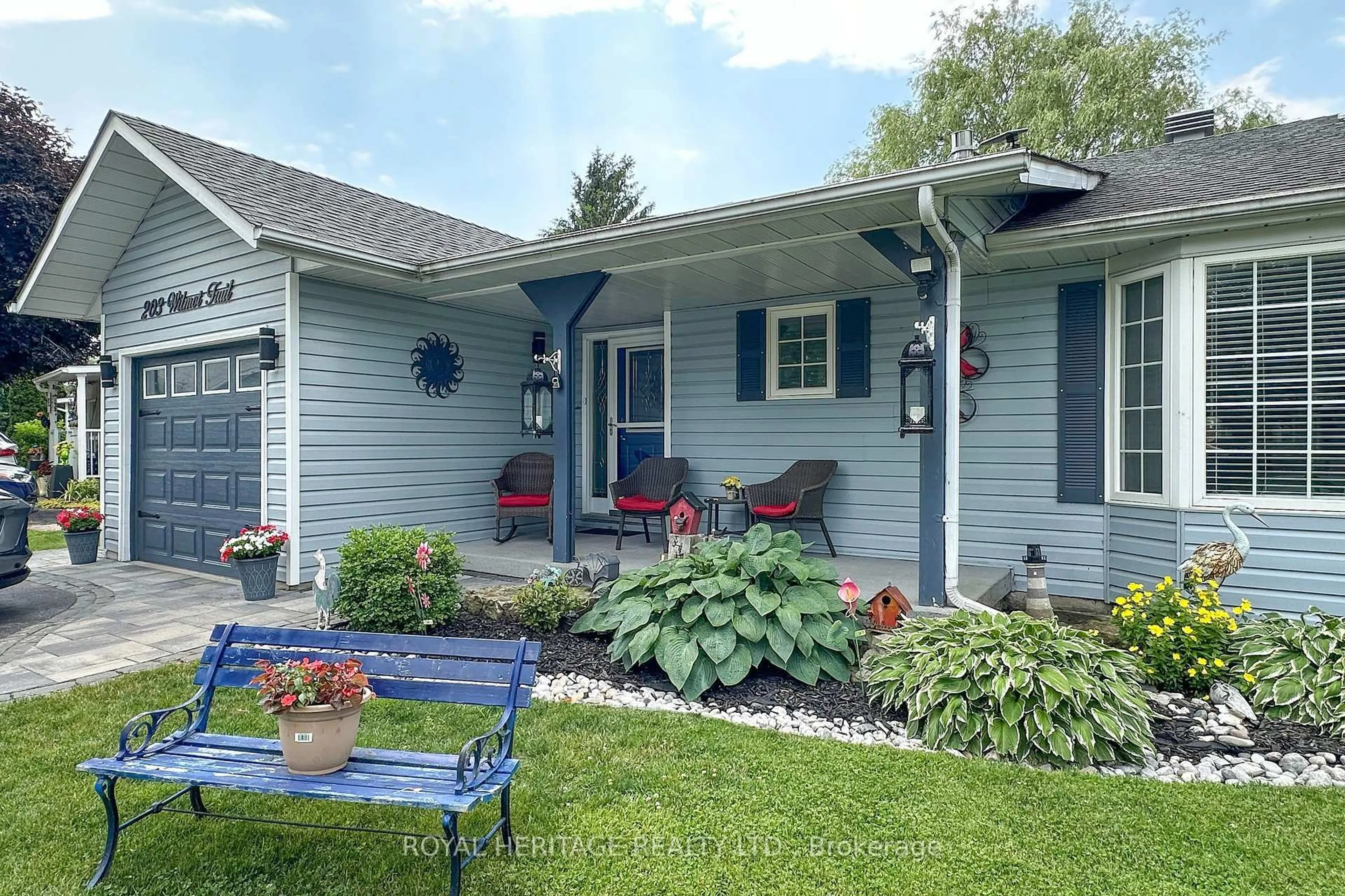 Home with vinyl exterior material, street for 203 Wilmot Tr, Clarington Ontario L1B 1A9