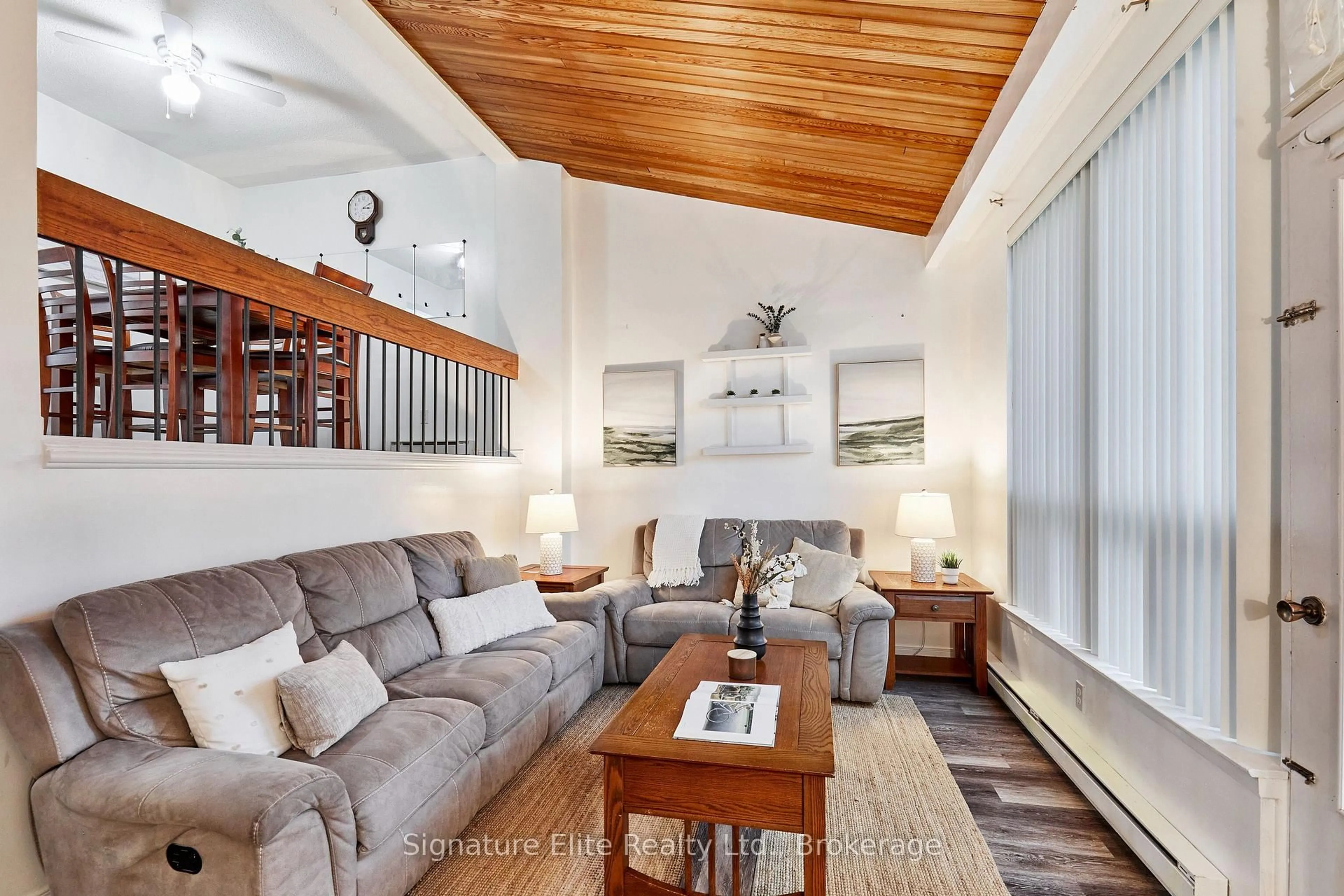 Living room with furniture, wood/laminate floor for 331 Military Tr #10, Toronto Ontario M1E 4E3