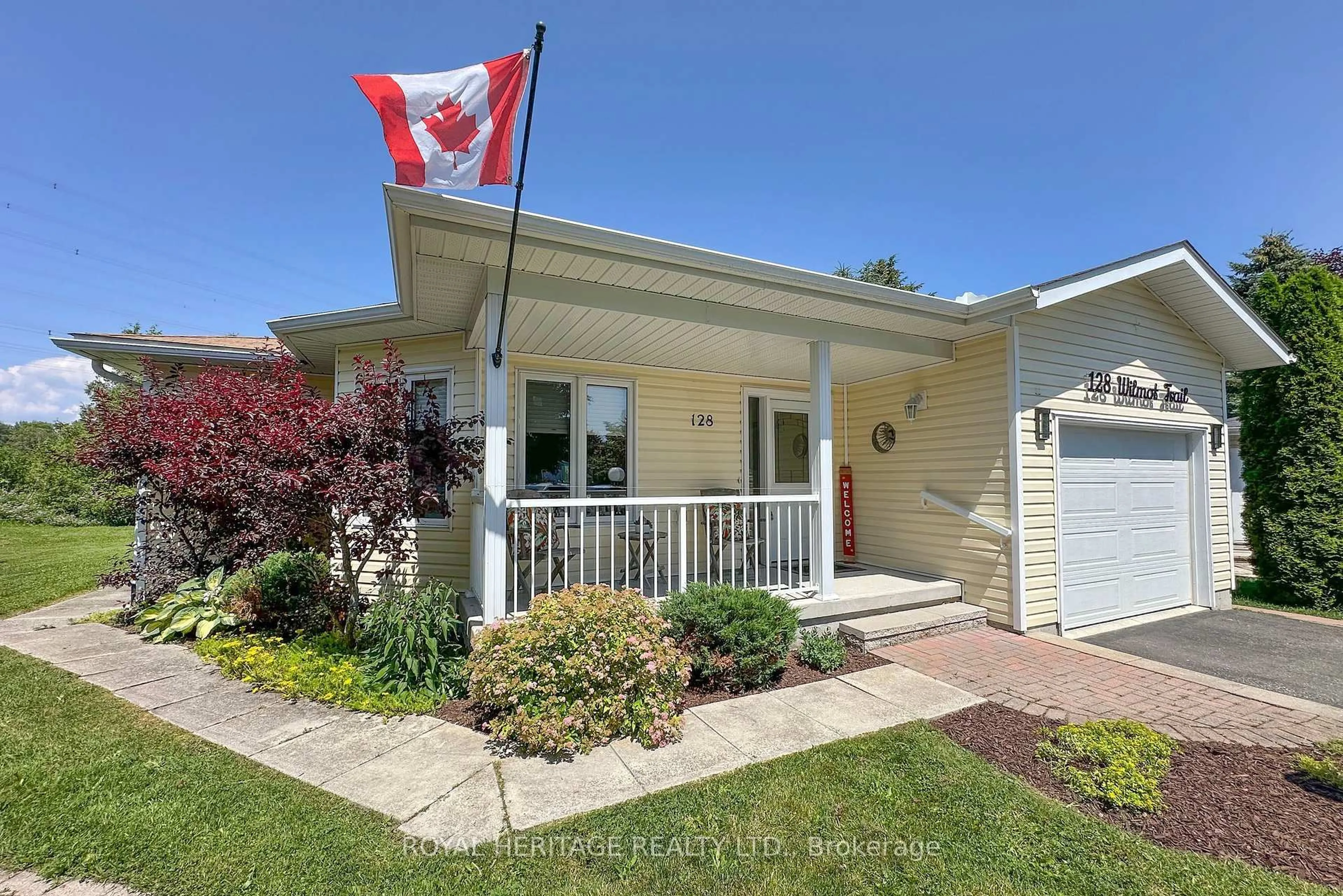 Home with vinyl exterior material, street for 128 Wilmot Tr, Clarington Ontario L1B 1B9