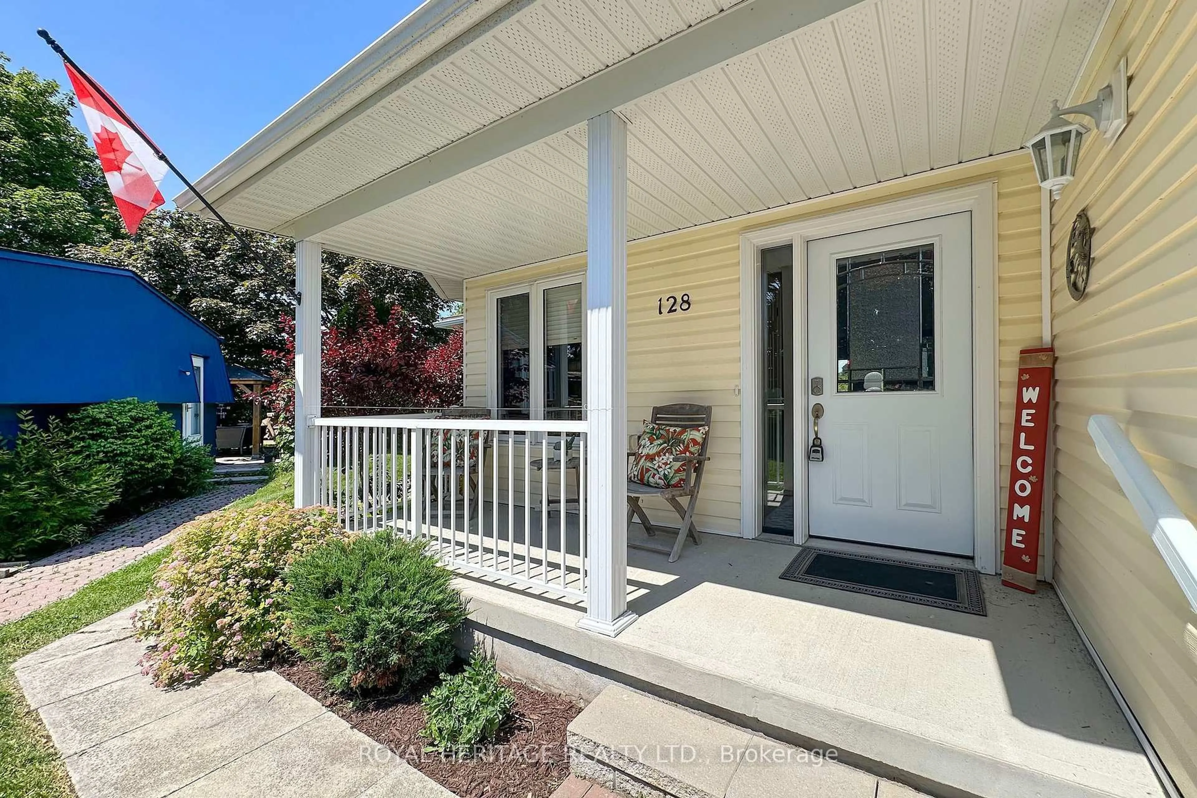 Home with vinyl exterior material, street for 128 Wilmot Tr, Clarington Ontario L1B 1B9