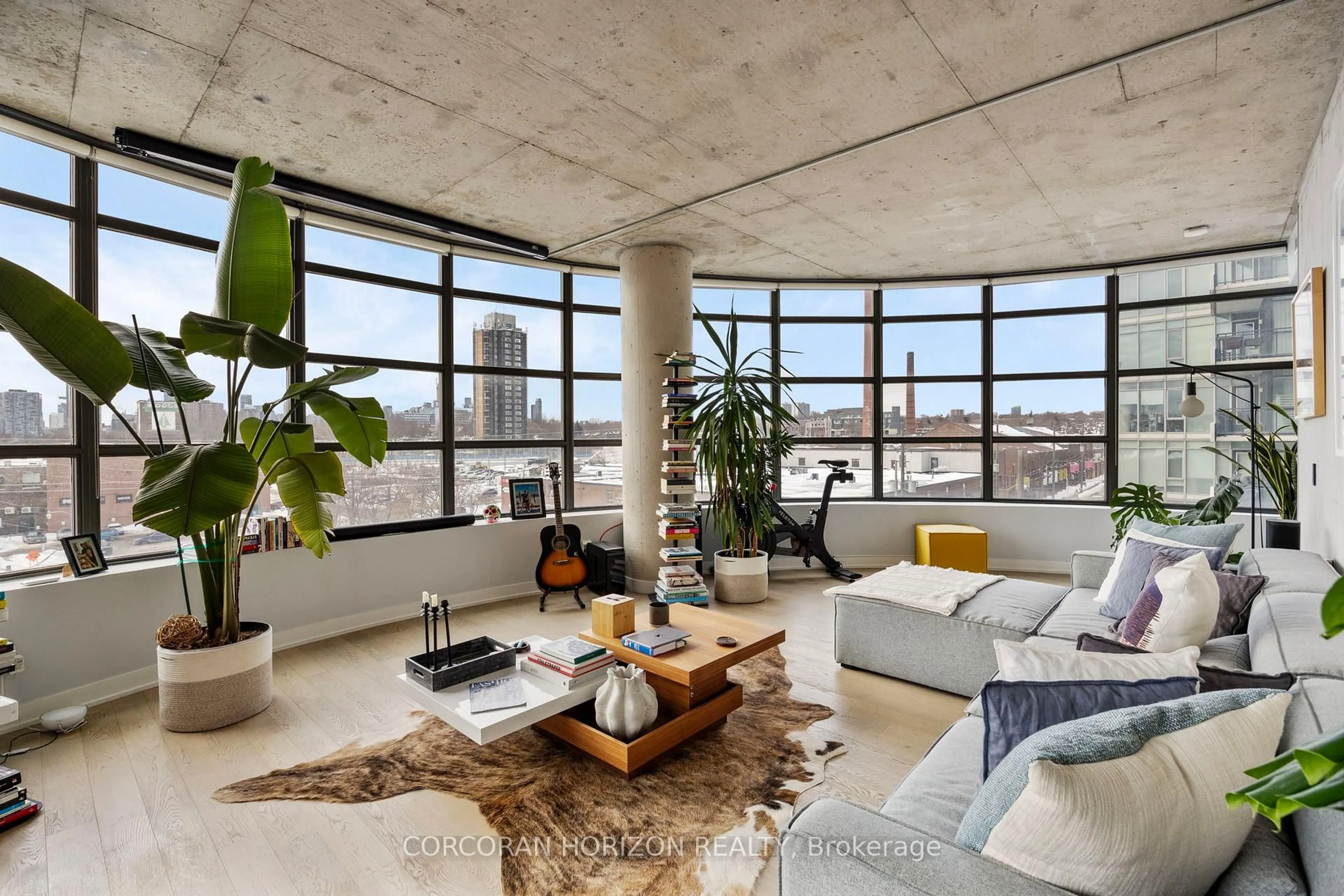 Living room with furniture, cement floor for 1201 Dundas St #503, Toronto Ontario M4M 1S2