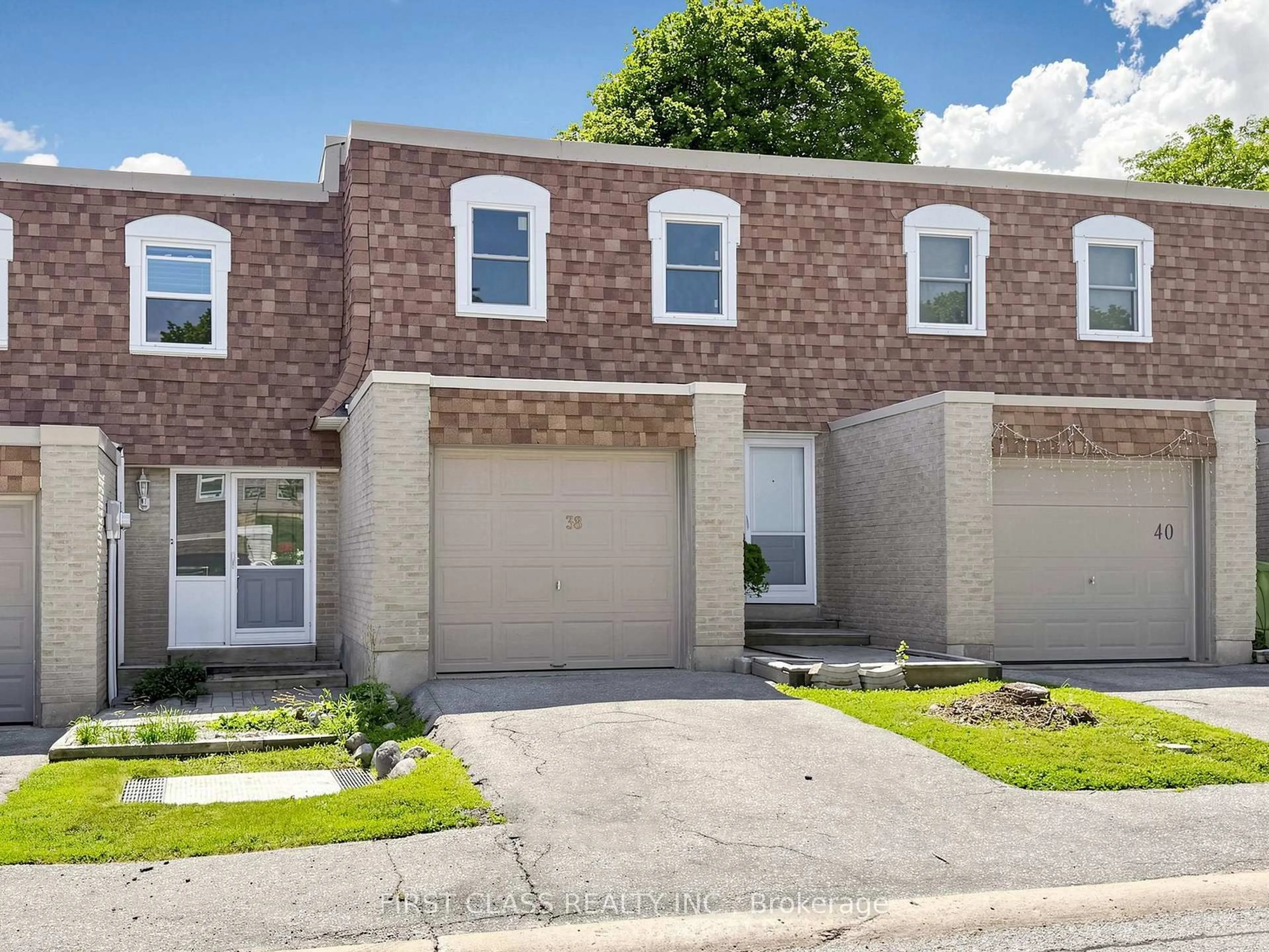 Home with brick exterior material, street for 850 Huntingwood Dr #38, Toronto Ontario M1T 2L9