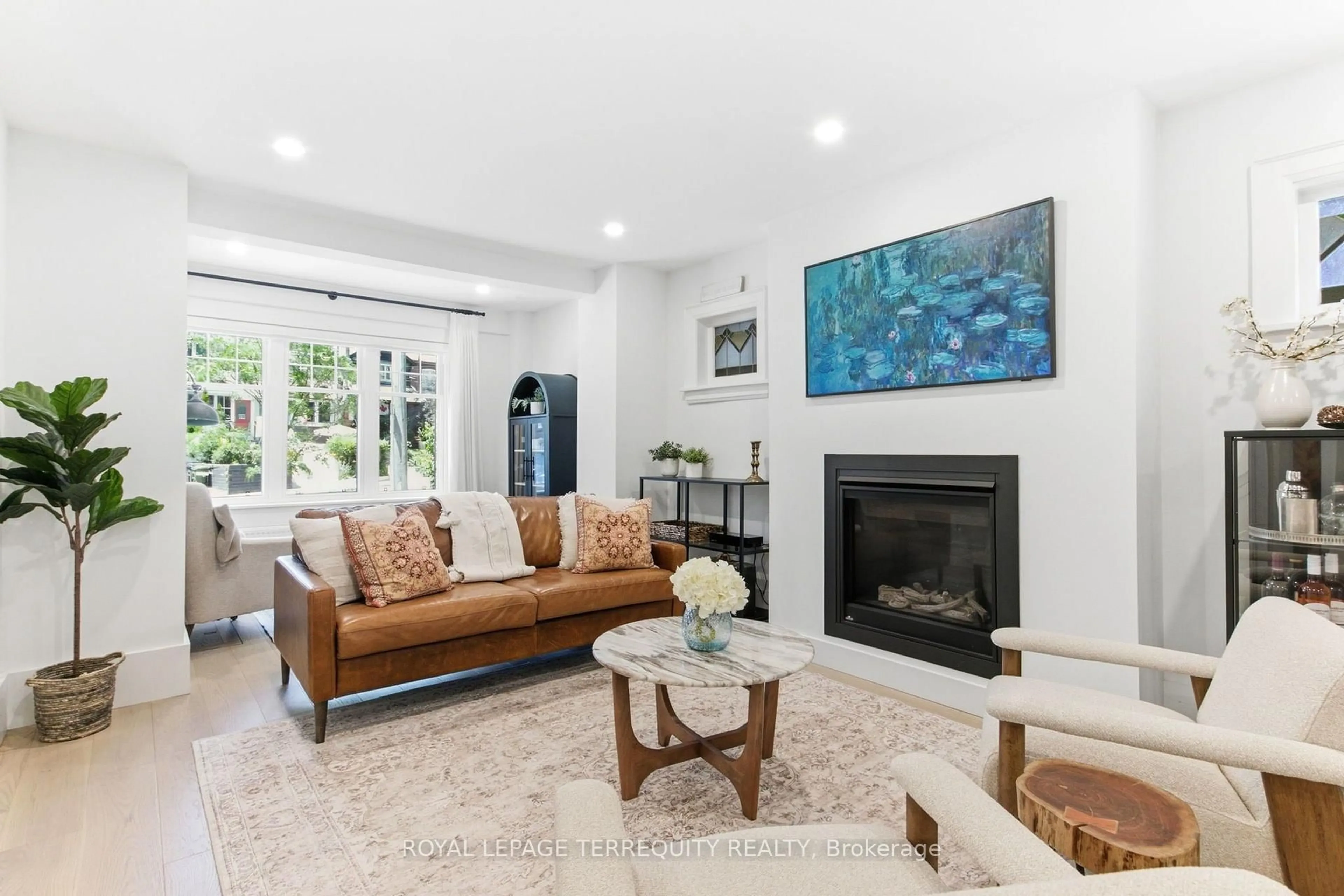 Living room with furniture, ceramic/tile floor for 1775 Gerrard St, Toronto Ontario M4L 2B3