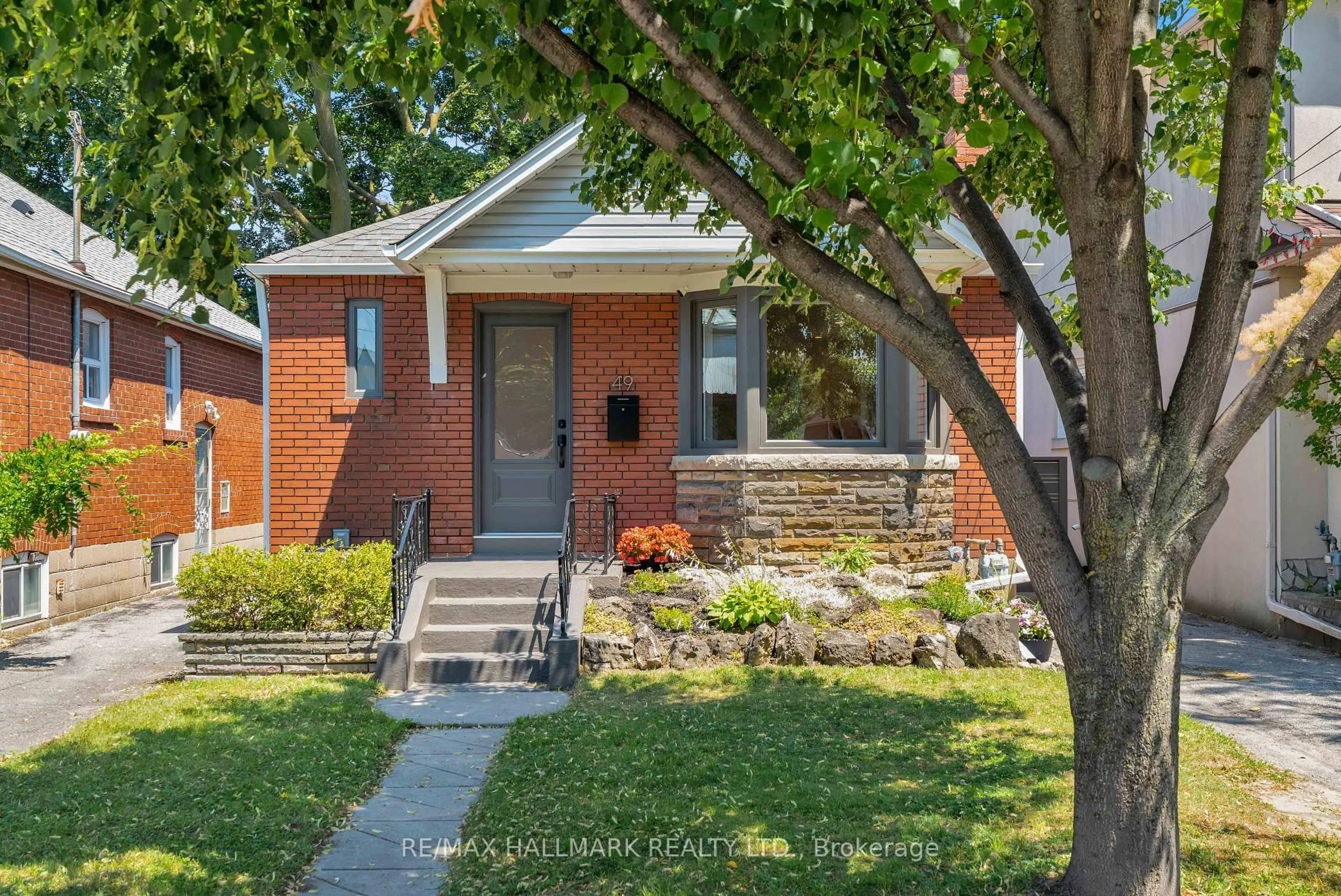 Home with brick exterior material, street for 49 Binswood Ave, Toronto Ontario M4C 3N6