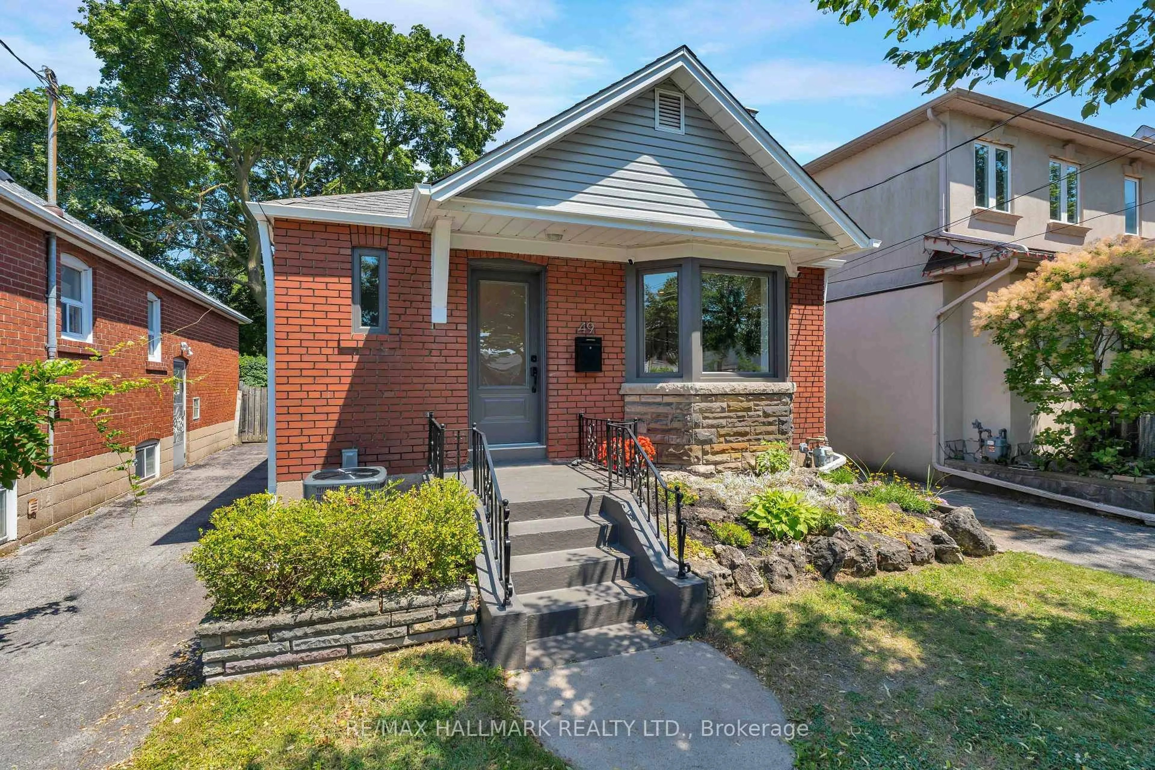 Home with brick exterior material, street for 49 Binswood Ave, Toronto Ontario M4C 3N6