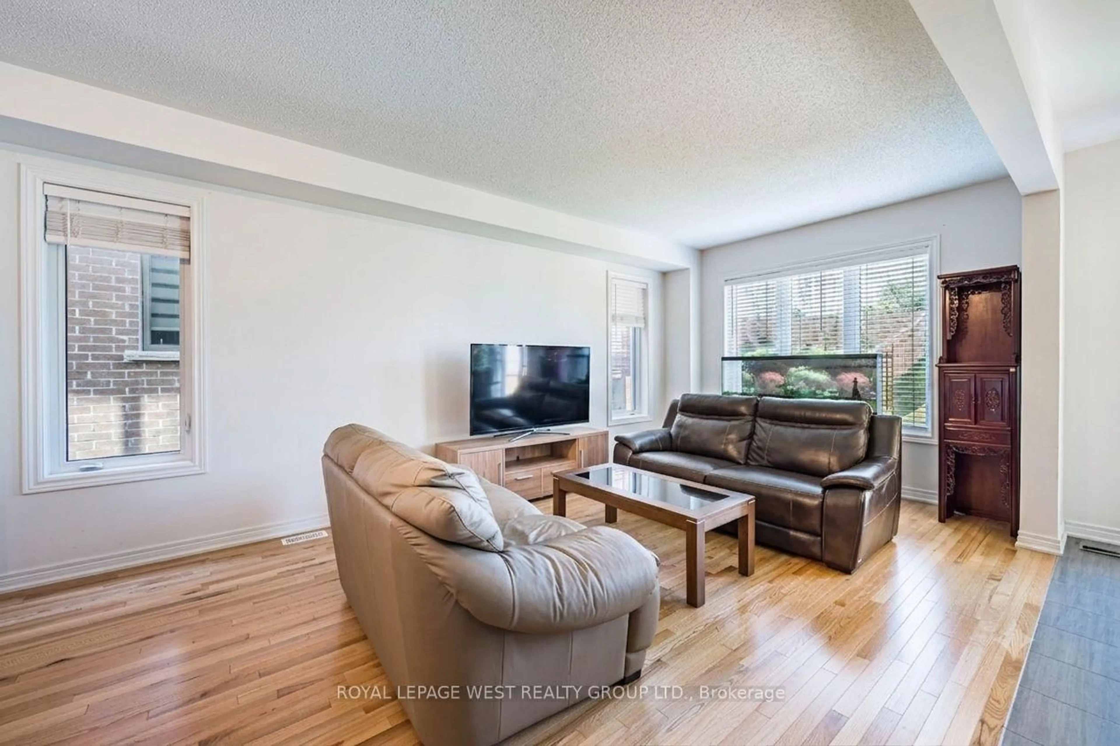 Living room with furniture, wood/laminate floor for 1278 Aquarius Tr, Pickering Ontario L1X 0L9