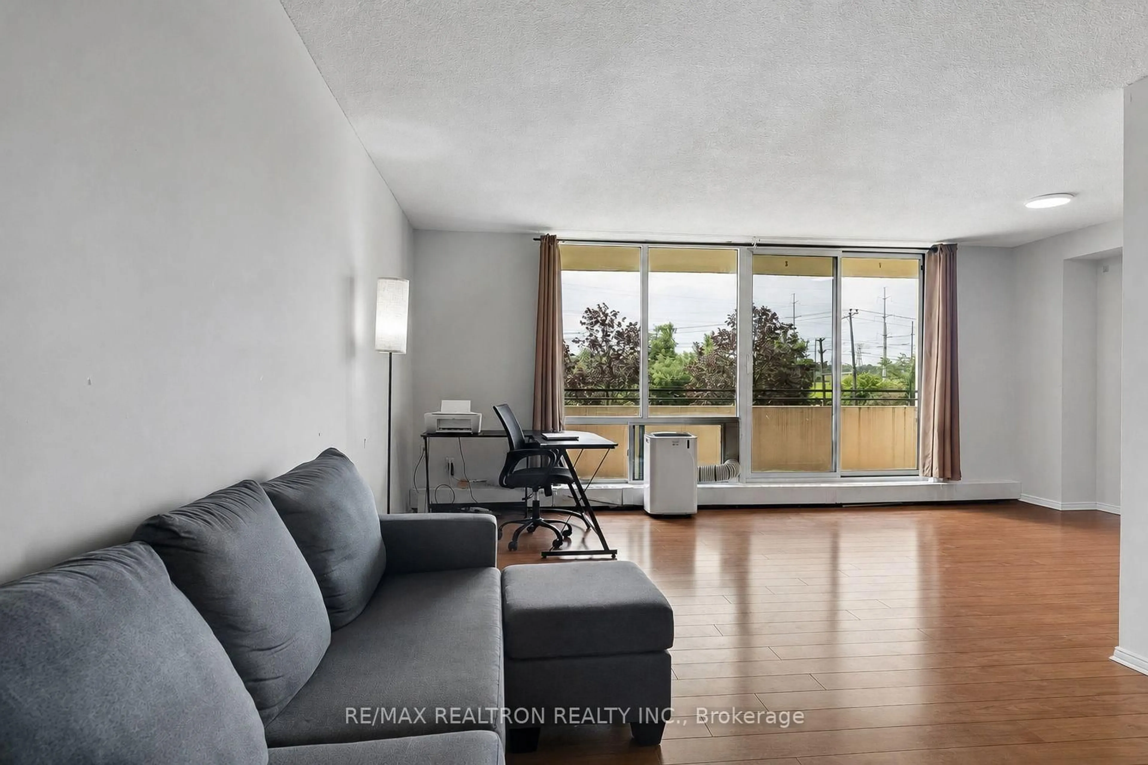 Living room with furniture, unknown for 101 Prudential Dr #205, Toronto Ontario M1P 4S5