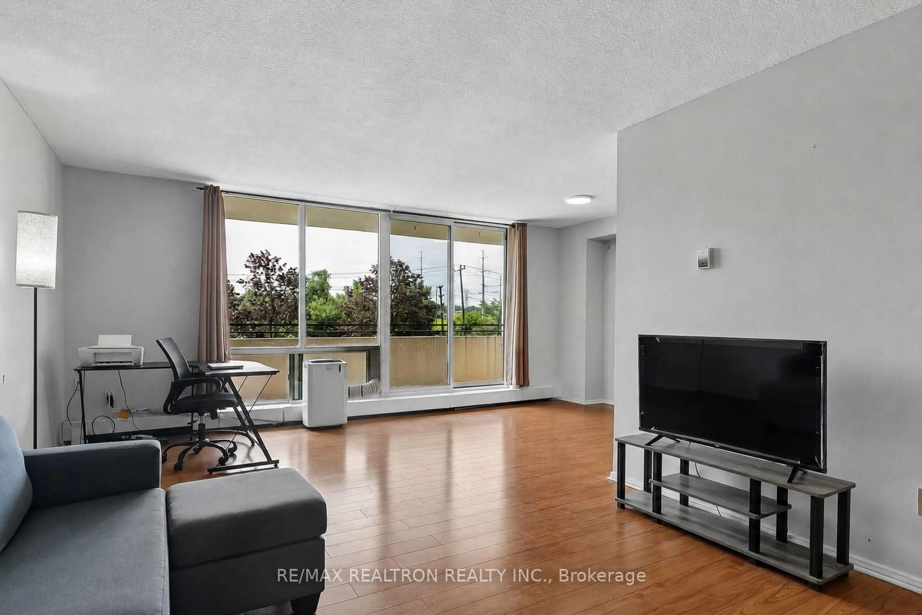 Living room with furniture, unknown for 101 Prudential Dr #205, Toronto Ontario M1P 4S5