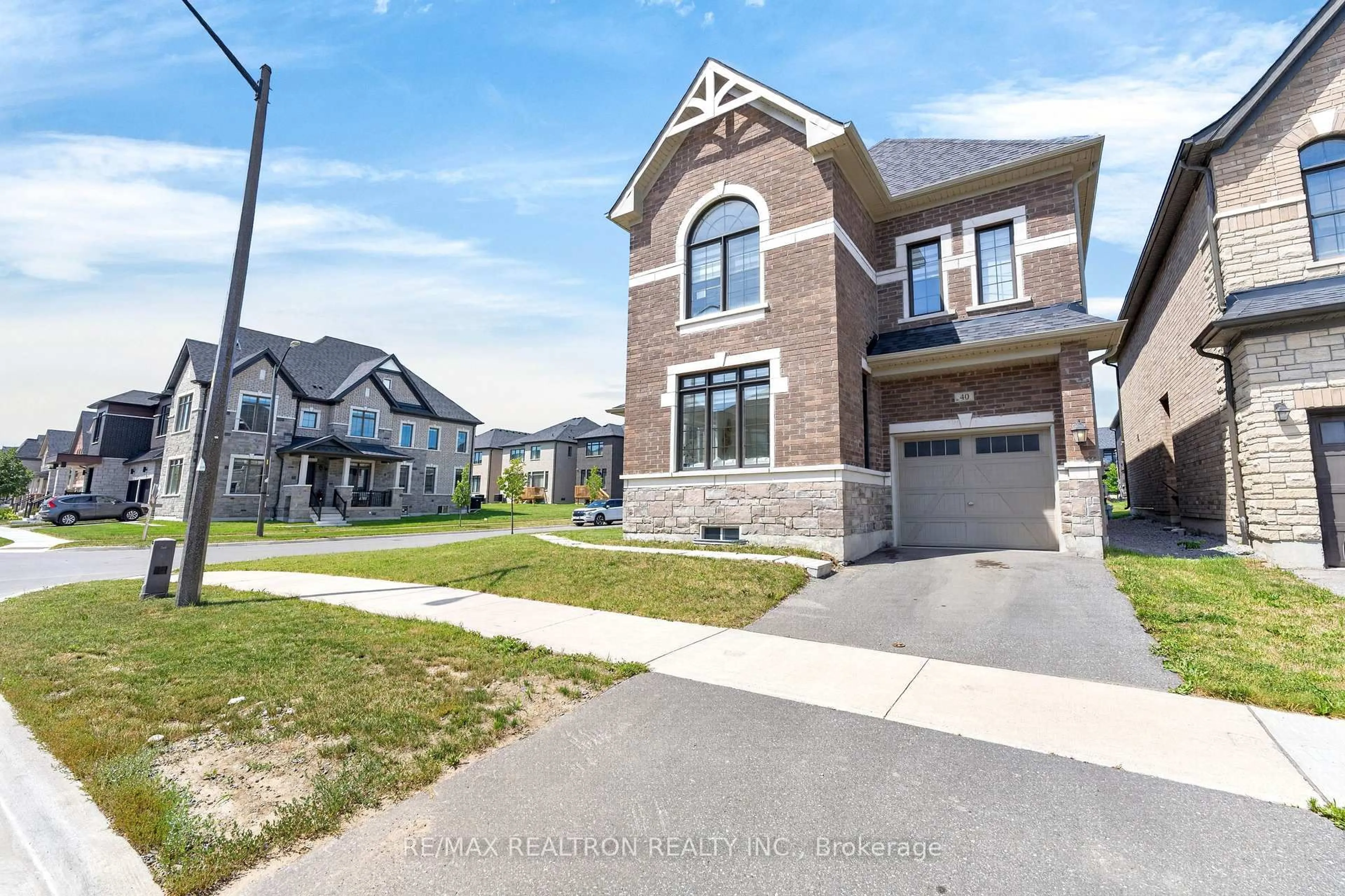 Home with brick exterior material, street for 40 Auckland Dr, Whitby Ontario L1P 0G7