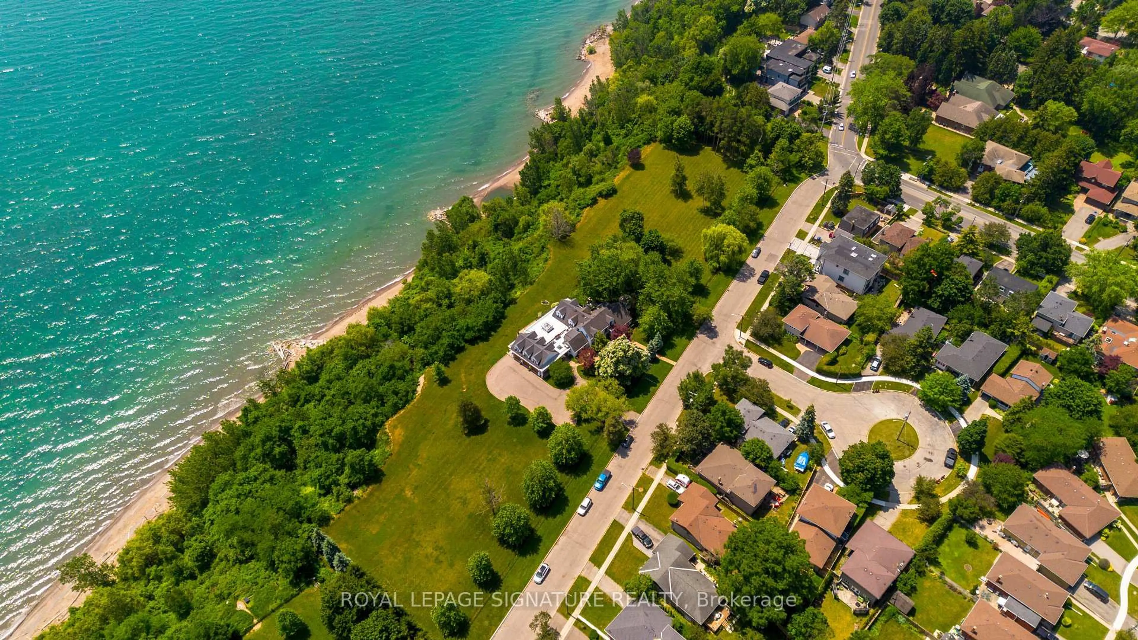 A pic from outside/outdoor area/front of a property/back of a property/a pic from drone, water/lake/river/ocean view for 220 Greyabbey Tr, Toronto Ontario M1E 1V9