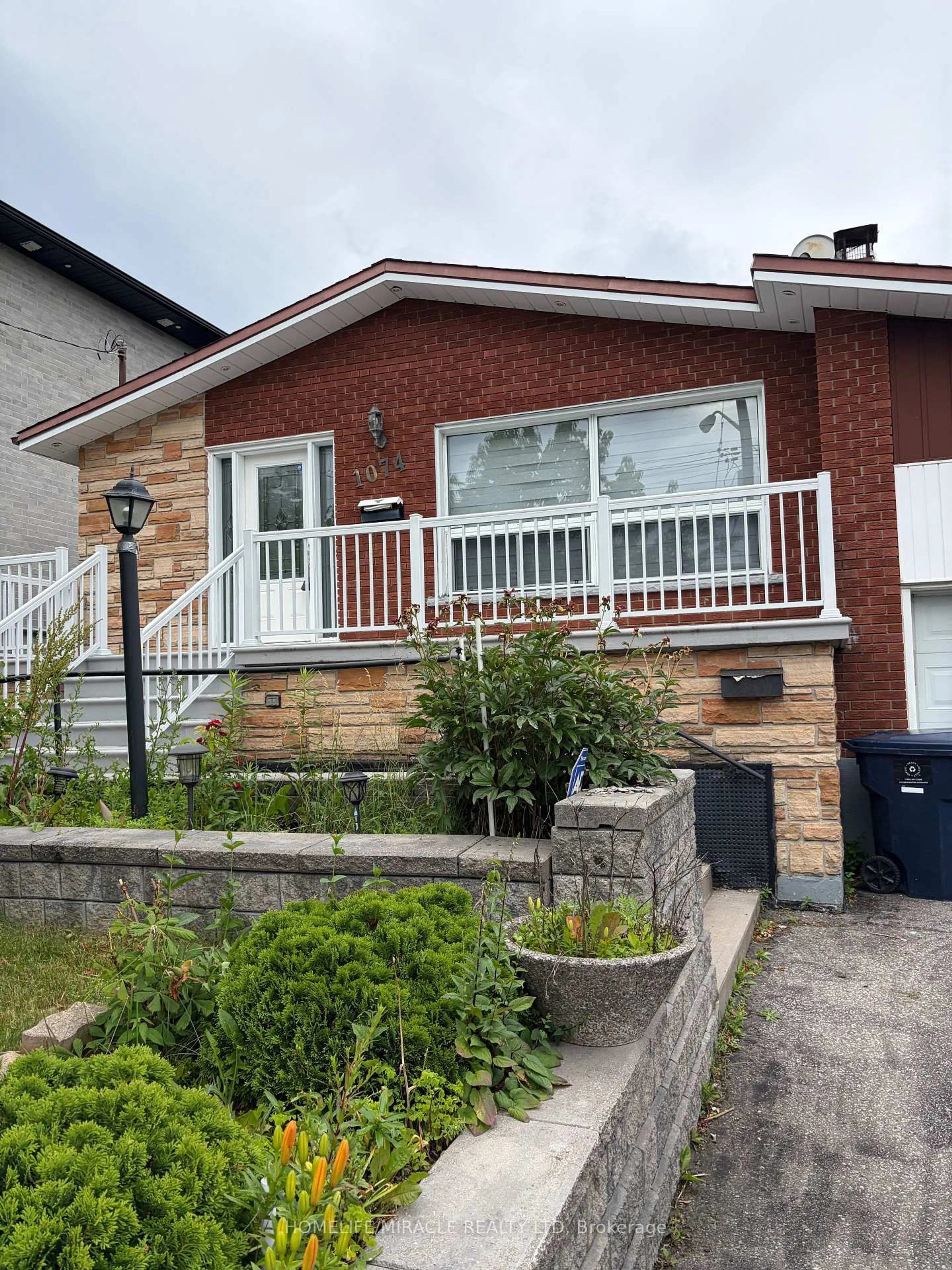 Home with brick exterior material, street for 1074 Midland Ave, Toronto Ontario M1K 4G9