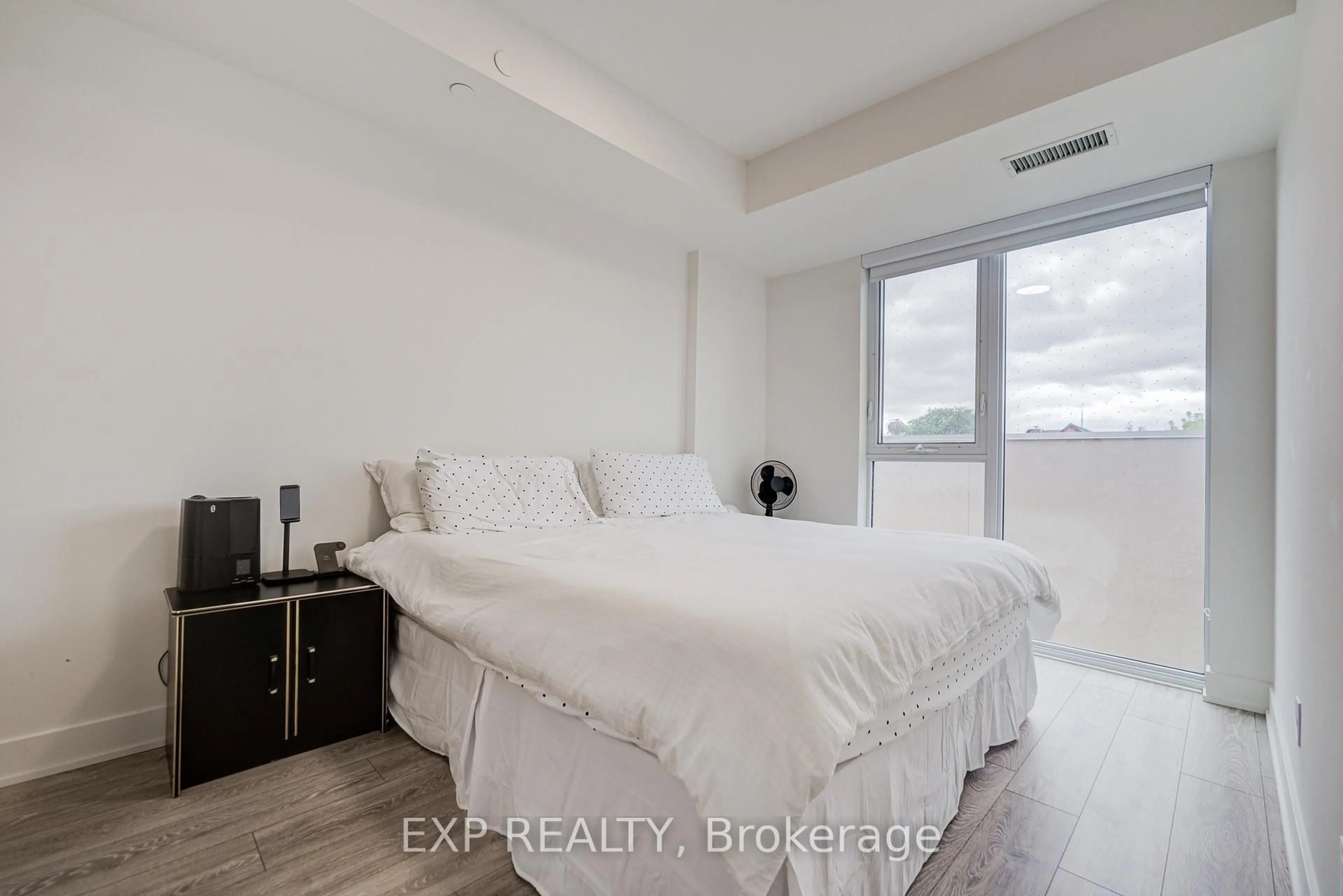 Bedroom with bed, unknown for 1285 Queen St #211, Toronto Ontario M4L 1C2