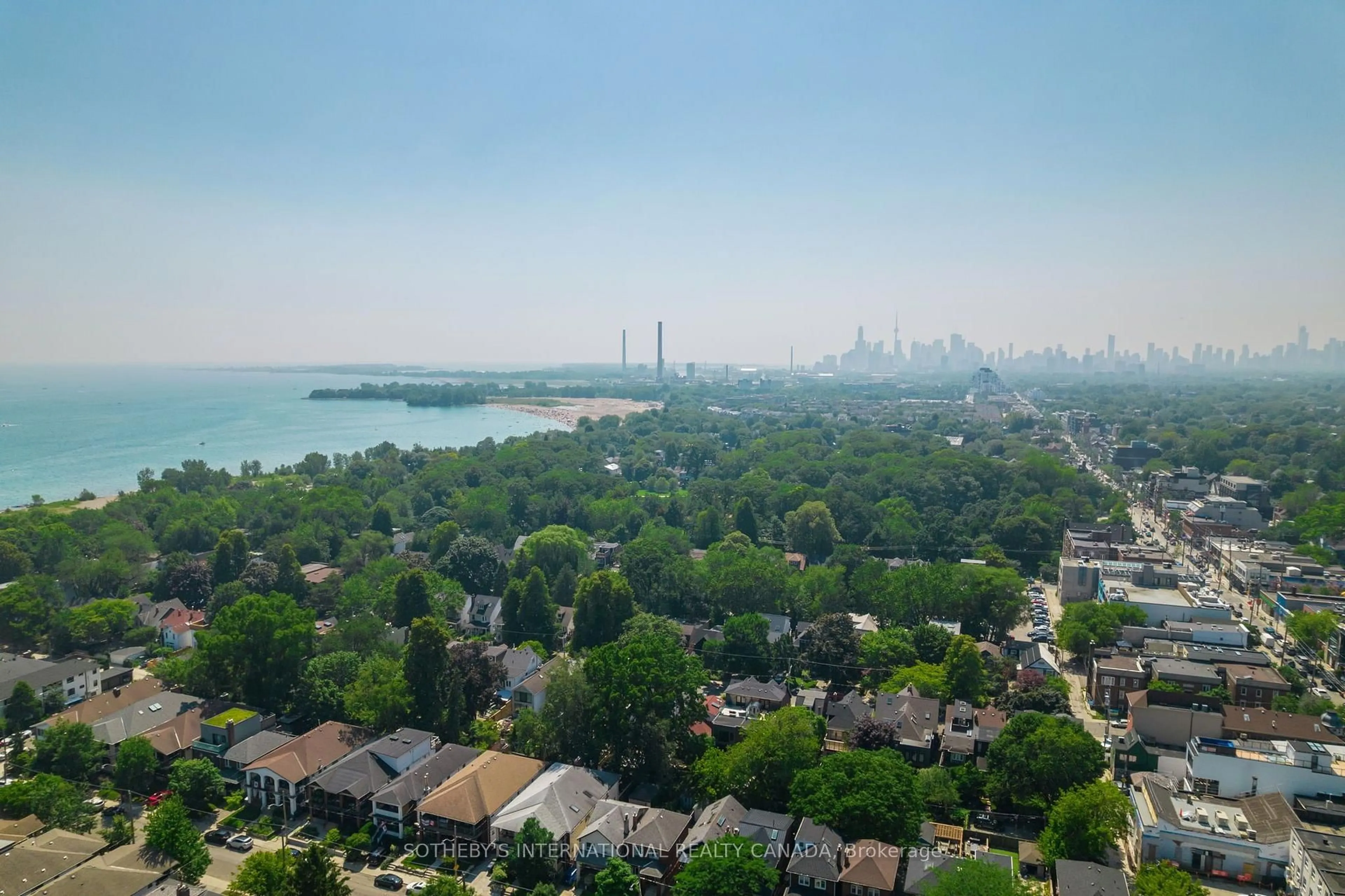 A pic from outside/outdoor area/front of a property/back of a property/a pic from drone, water/lake/river/ocean view for 101 Hammersmith Ave #210, Toronto Ontario M4E 2W3