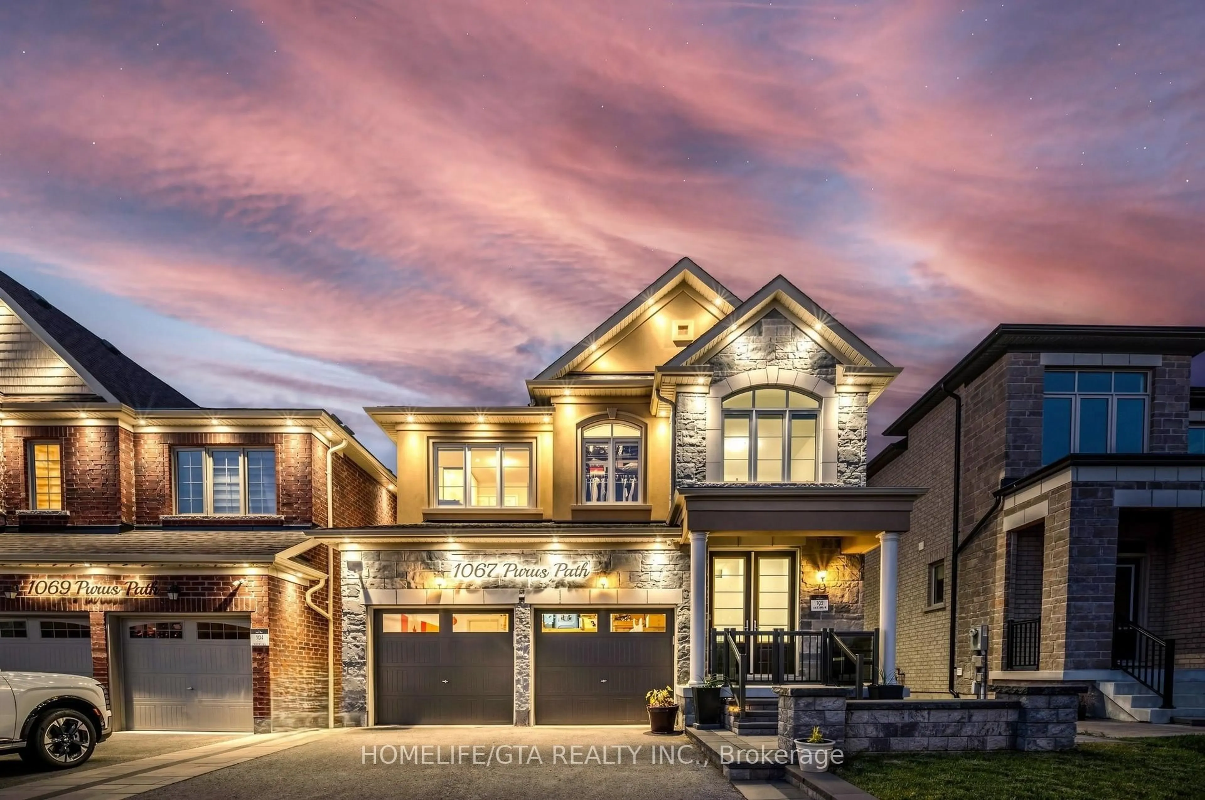 Home with brick exterior material, street for 1067 Purus Path, Pickering Ontario L1X 0H3