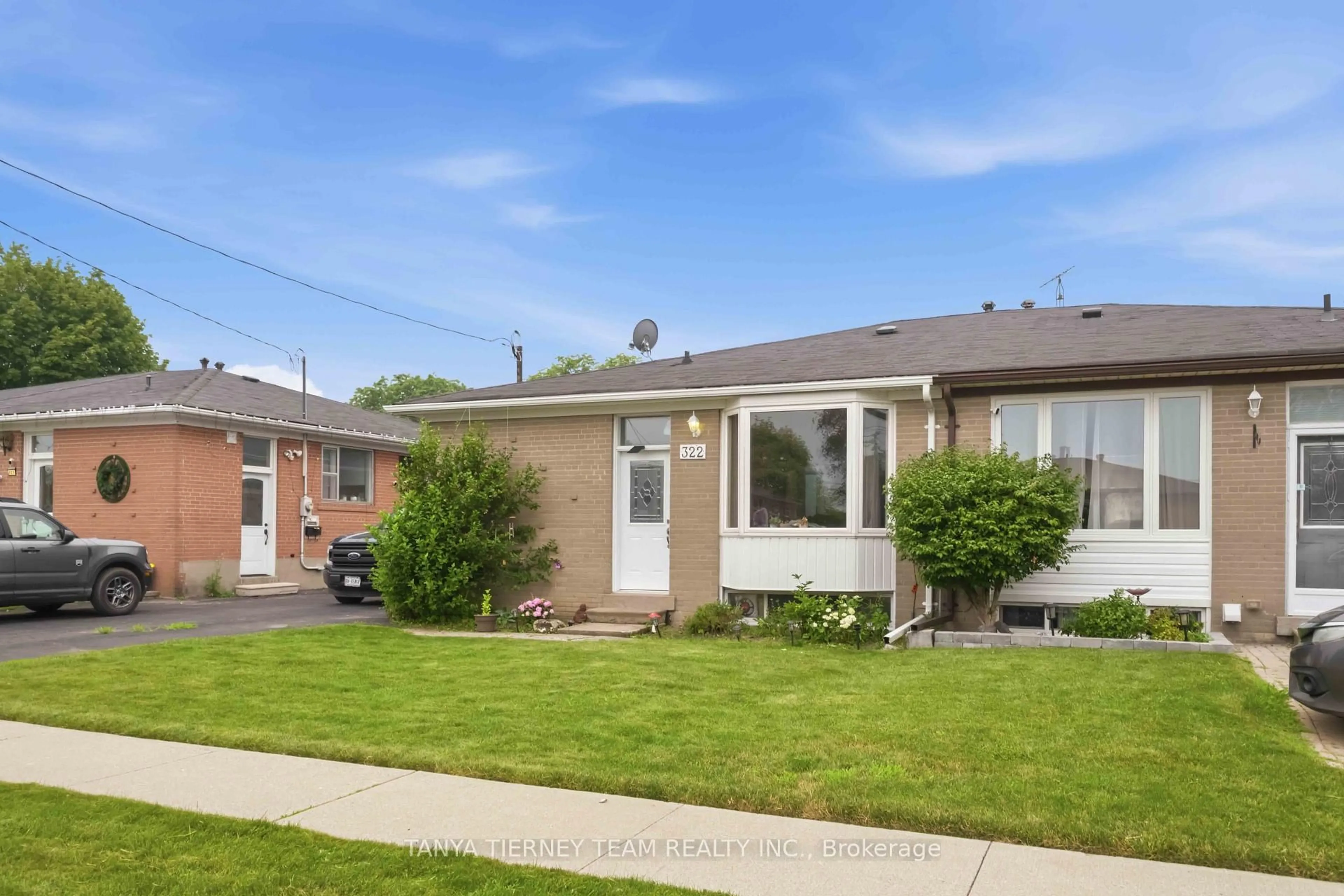 Home with brick exterior material, street for 322 Rosedale Dr, Whitby Ontario L1N 1Z3