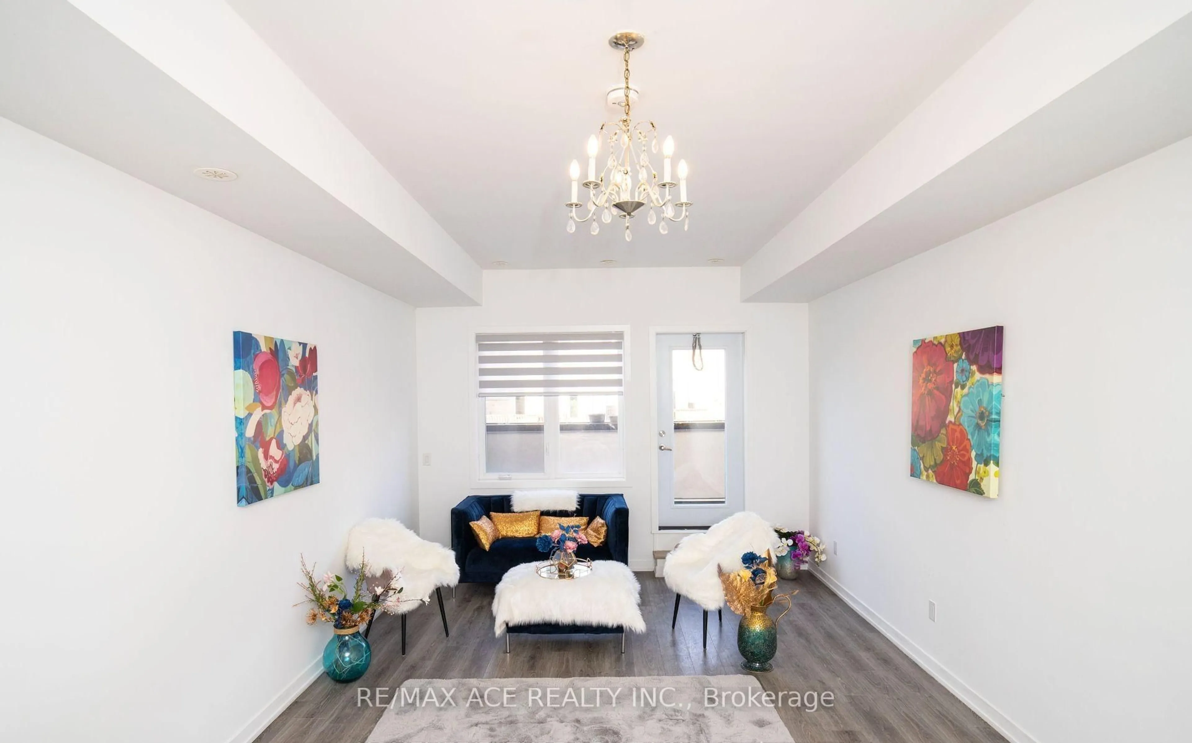 Living room with furniture, wood/laminate floor for 3686 St Clair Ave #105, Toronto Ontario M1M 0E4