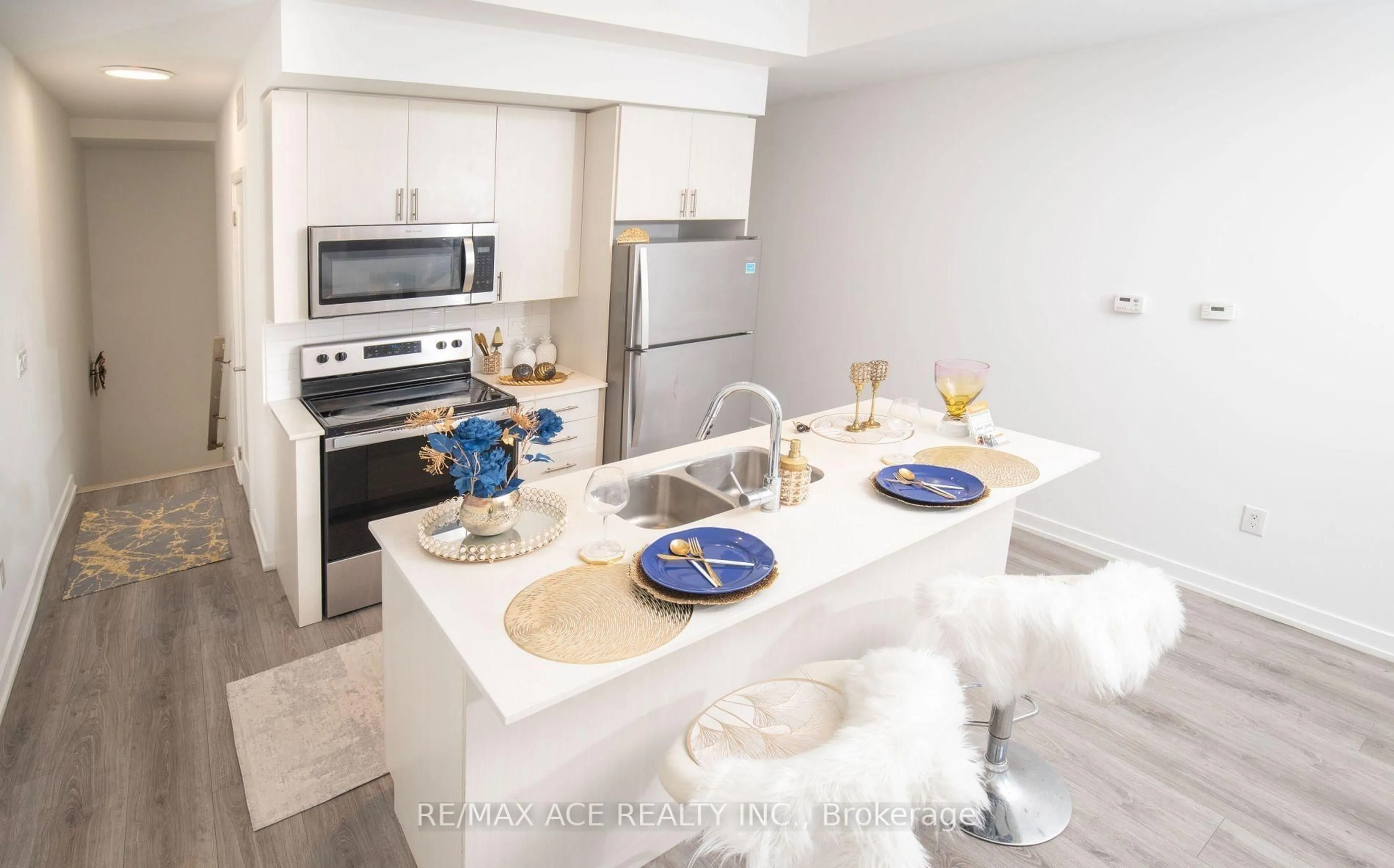 Open concept kitchen, ceramic/tile floor for 3686 St Clair Ave #105, Toronto Ontario M1M 0E4