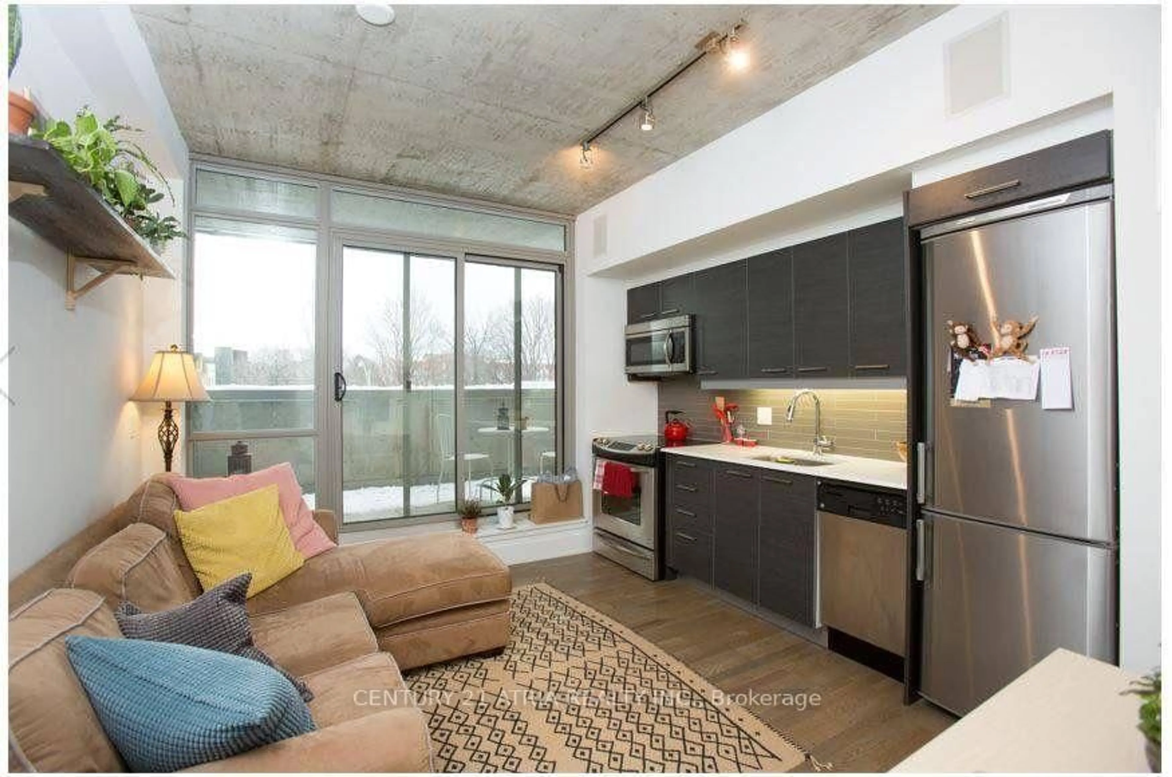 Open concept kitchen, cement floor for 630 Queen St #204, Toronto Ontario M4M 1G3