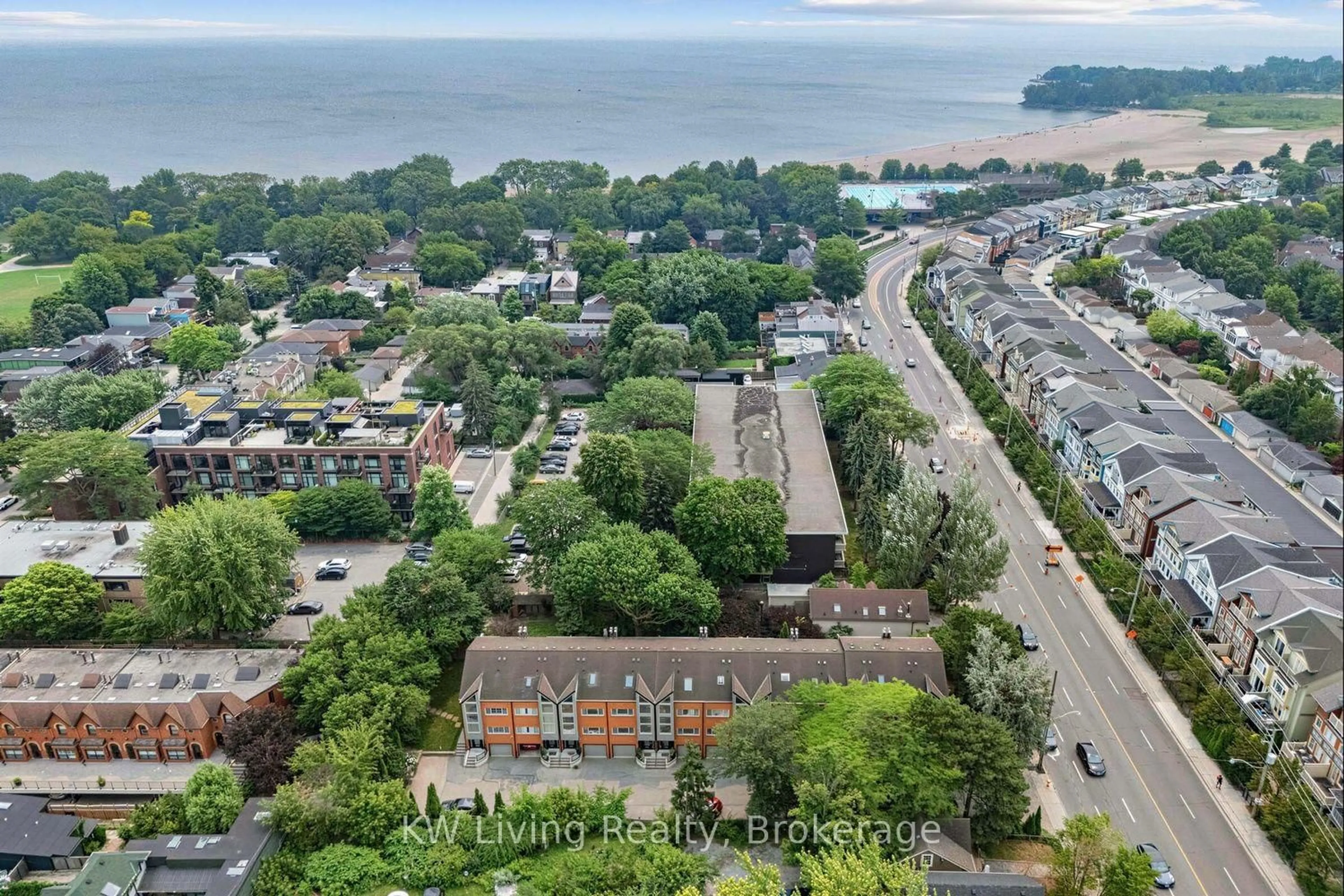 A pic from outside/outdoor area/front of a property/back of a property/a pic from drone, water/lake/river/ocean view for 155 Woodbine Ave #TH7, Toronto Ontario M4L 3P1