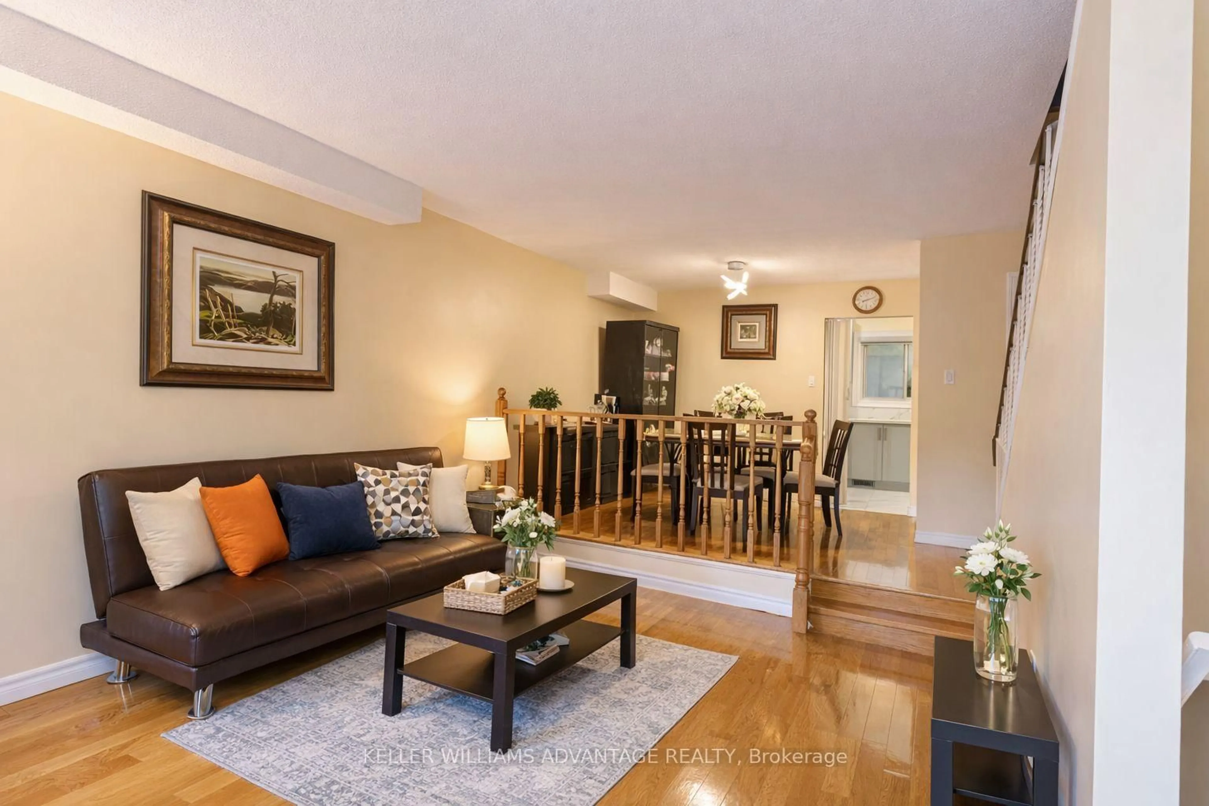 Living room with furniture, wood/laminate floor for 174 Homestead Rd, Toronto Ontario M1E 3S2