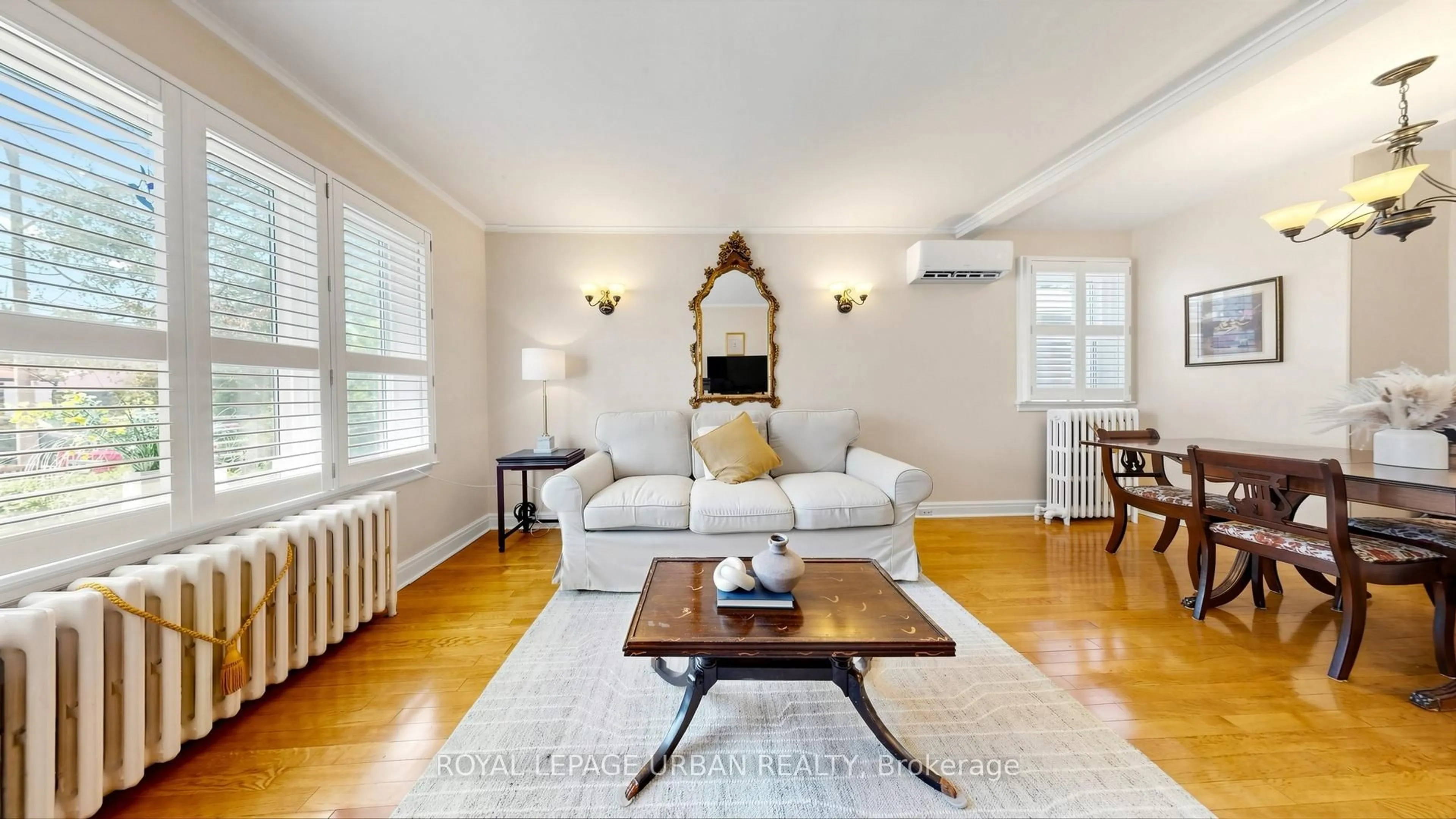 Living room with furniture, wood/laminate floor for 202 Virginia Ave, Toronto Ontario M4C 2T7