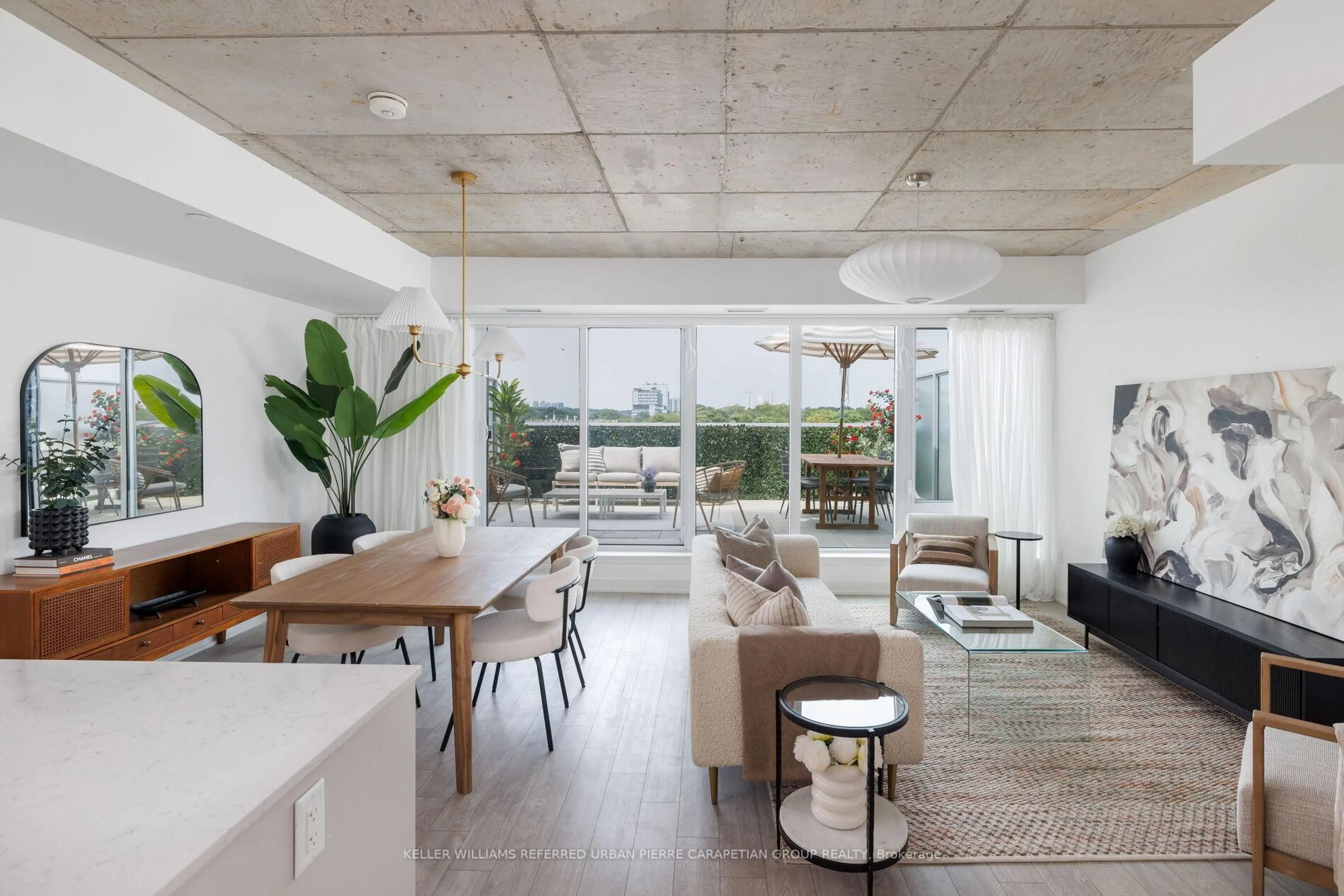 Living room with furniture, cement floor for 665 Queen St #502, Toronto Ontario M4M 1G4