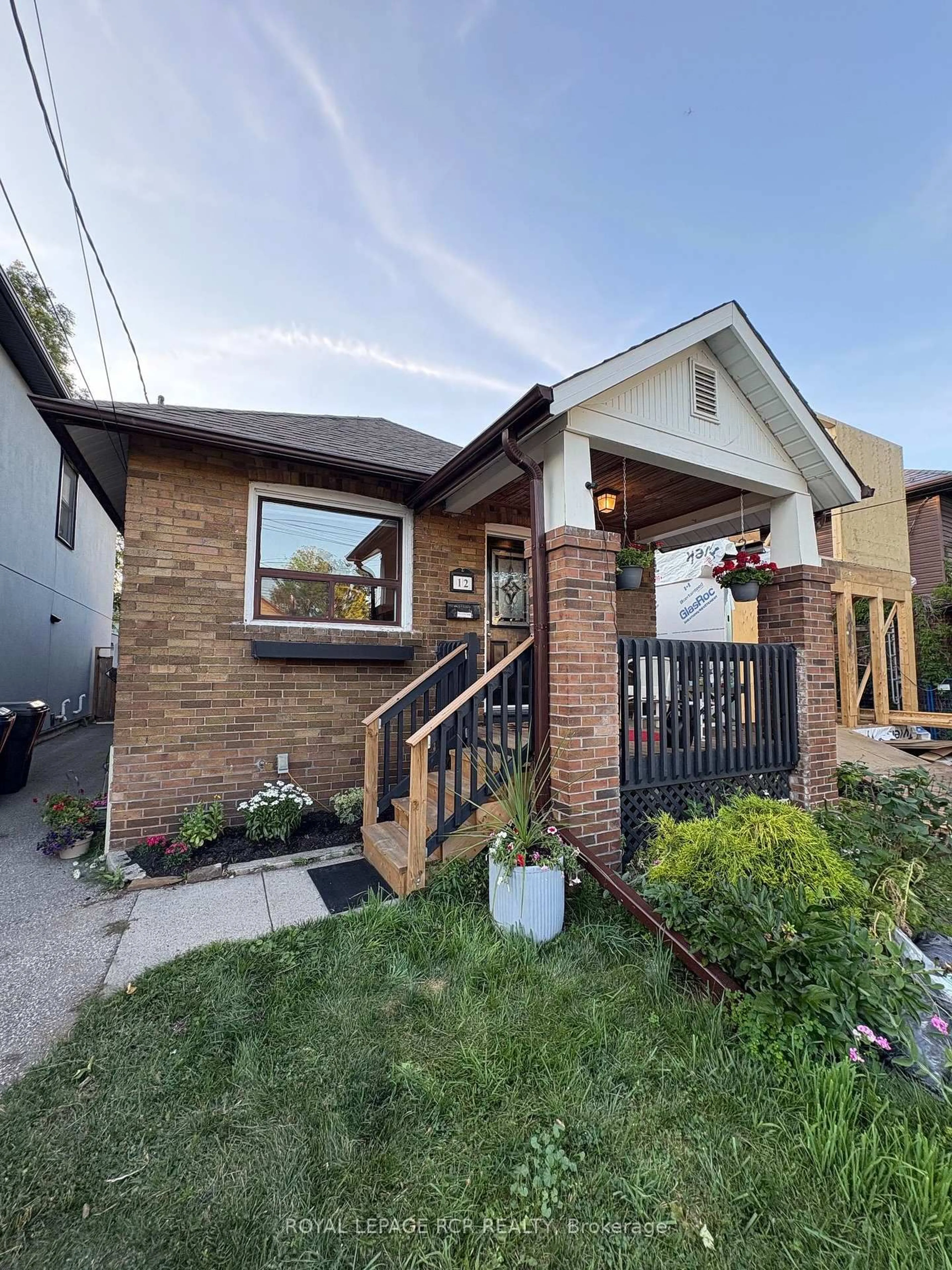Home with brick exterior material, street for 12 Orley Ave, Toronto Ontario M4C 2B9