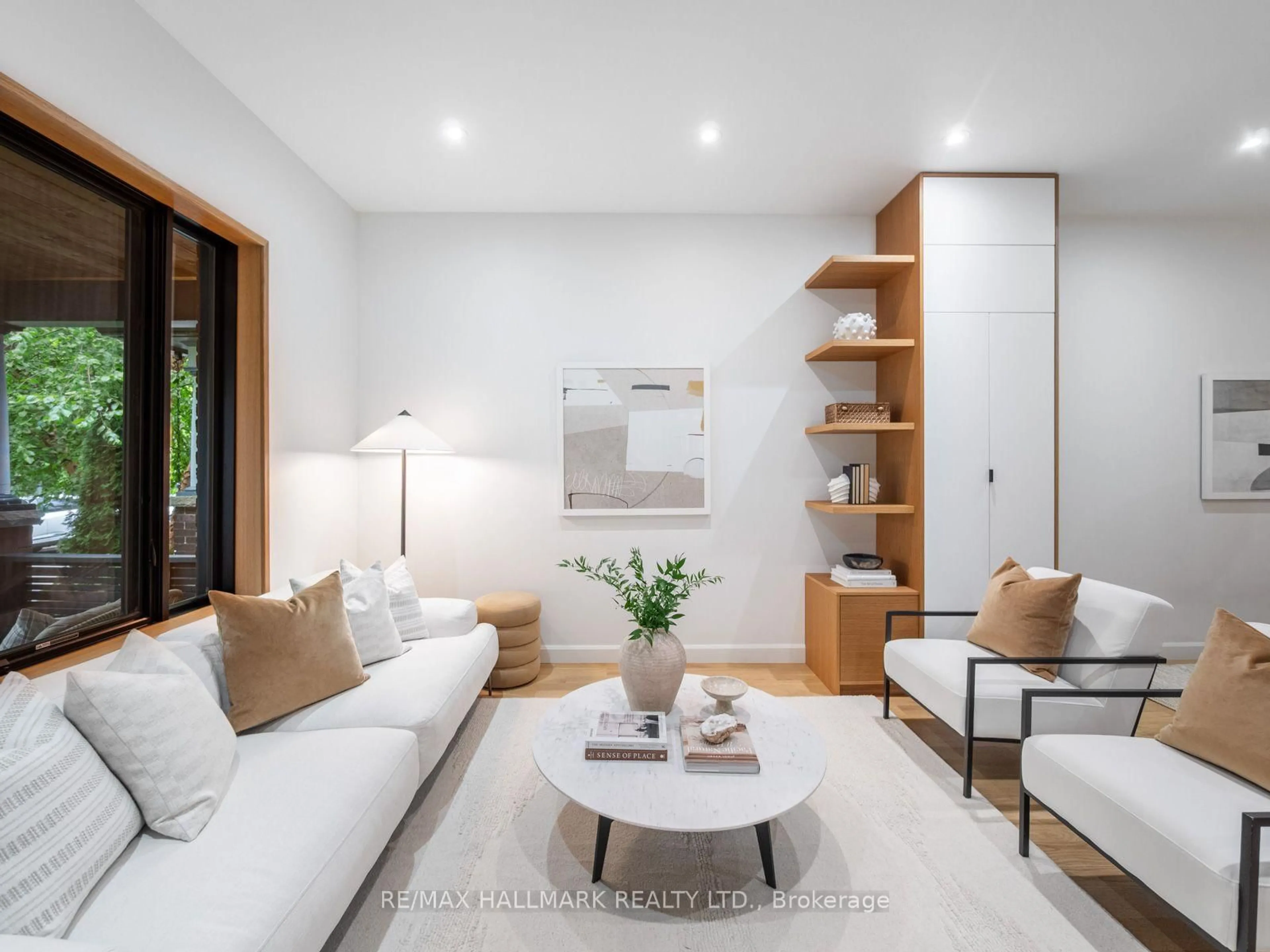 Living room with furniture, wood/laminate floor for 80 Winnifred Ave, Toronto Ontario M4M 2X3