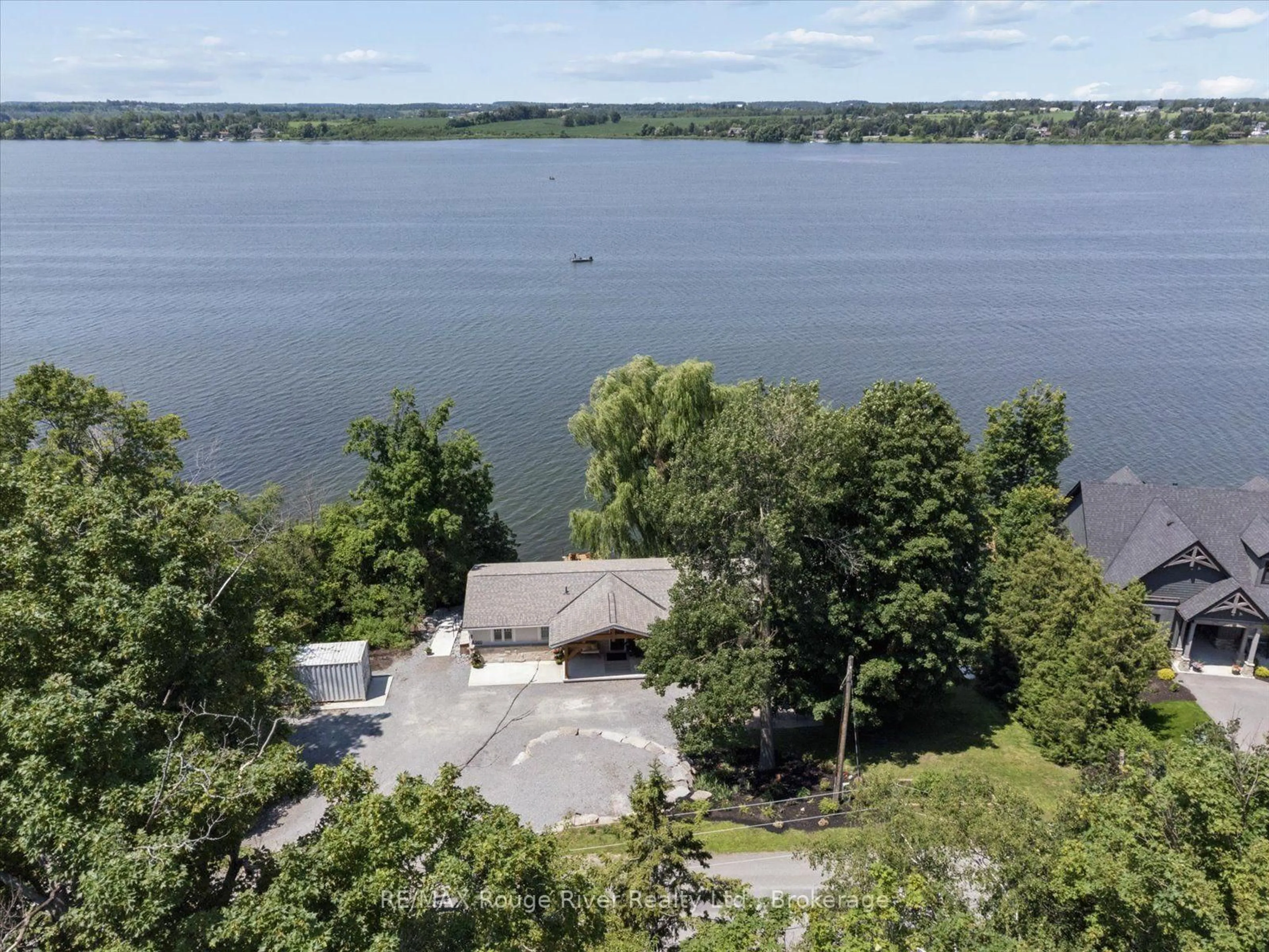 A pic from outside/outdoor area/front of a property/back of a property/a pic from drone, water/lake/river/ocean view for 500 Fralicks Beach Rd, Scugog Ontario L9L 1B6