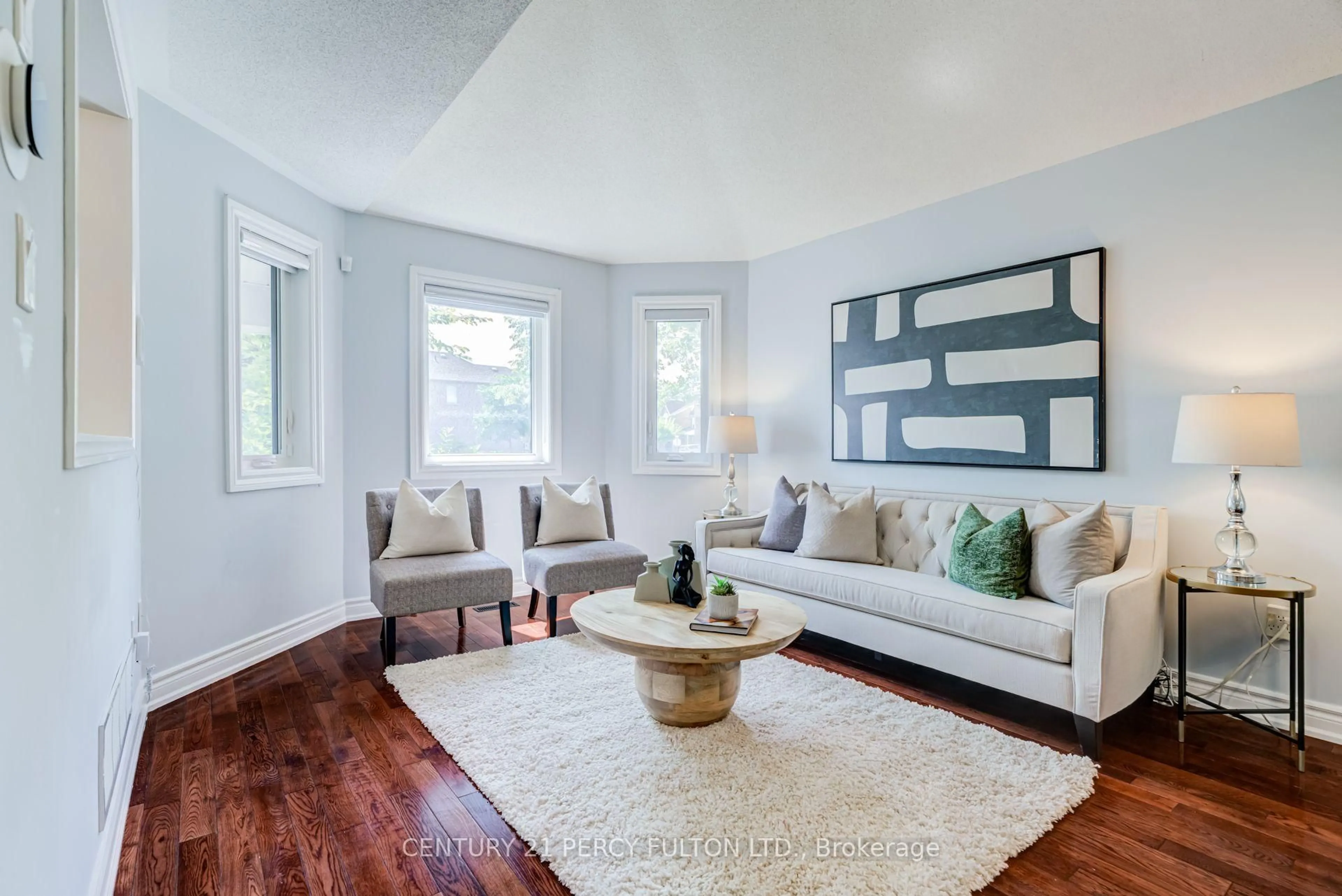 Living room with furniture, wood/laminate floor for 375 Chickadee Crt, Pickering Ontario L1V 6Y4