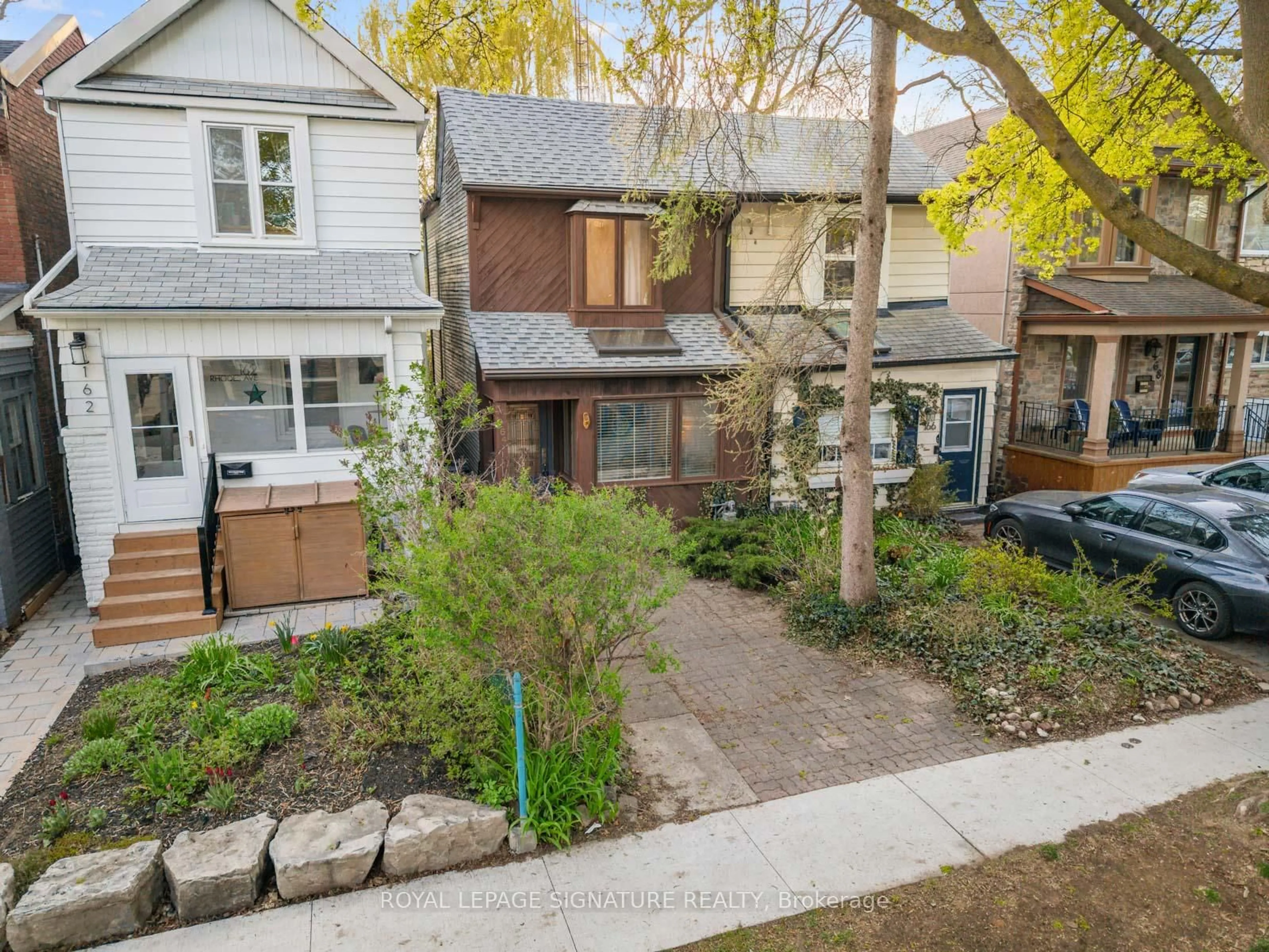 A pic from outside/outdoor area/front of a property/back of a property/a pic from drone, street for 164 Rhodes Ave, Toronto Ontario M4L 3A1