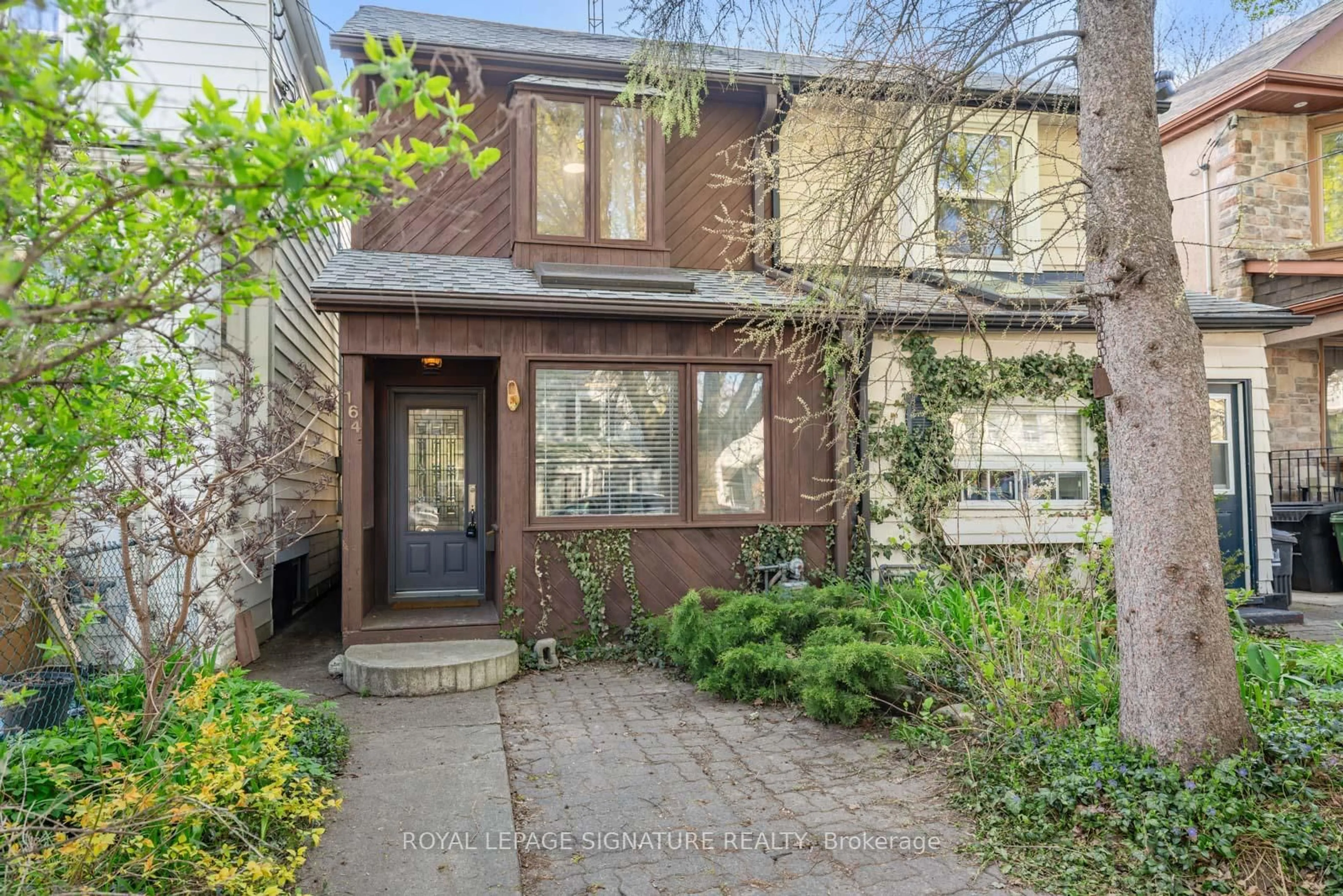 Home with brick exterior material, street for 164 Rhodes Ave, Toronto Ontario M4L 3A1